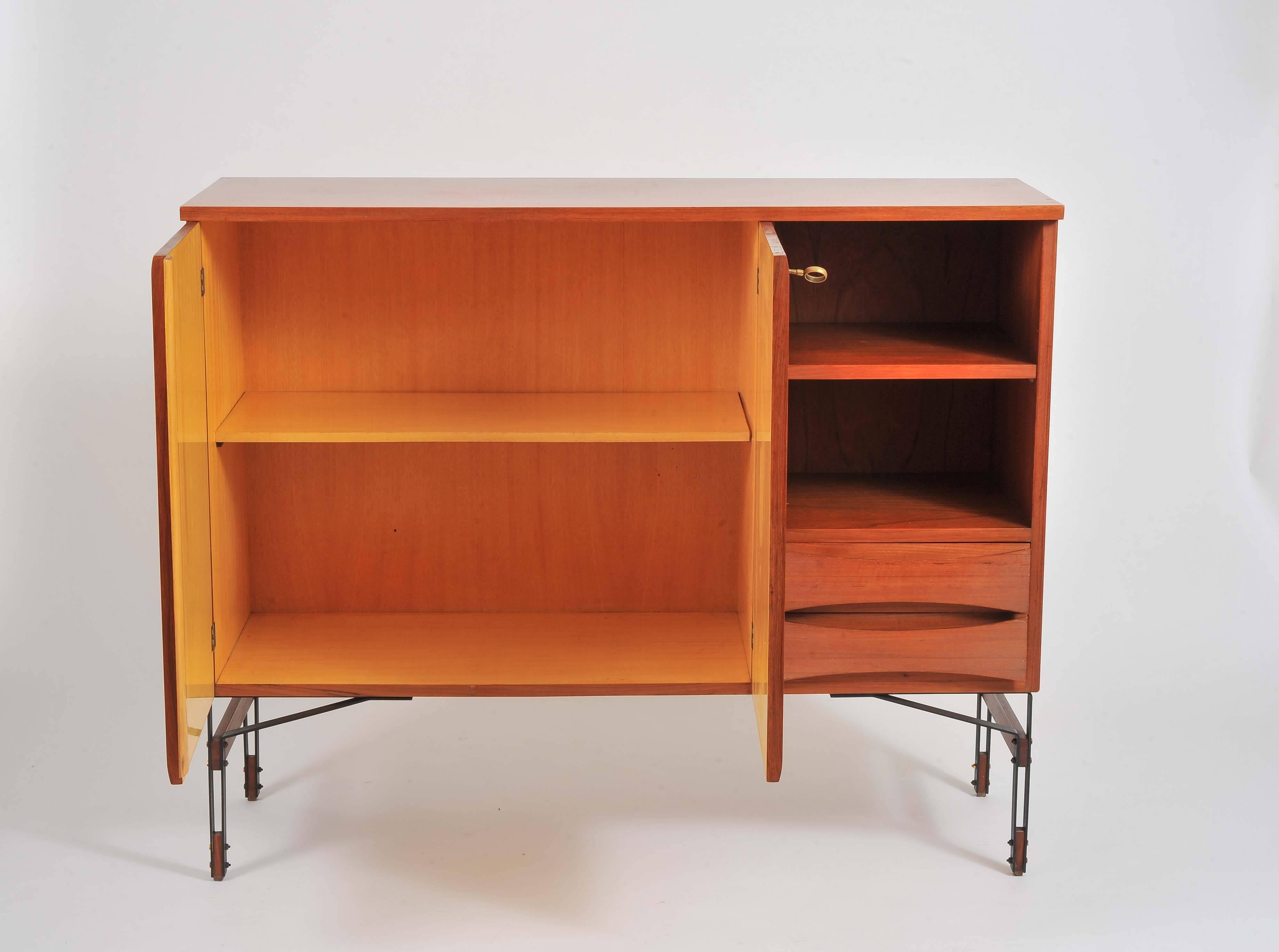 Cabinet or sideboard most probably Ico Parisi 
Lacquered metal legs with brass and wood detail.
Brass key.

 