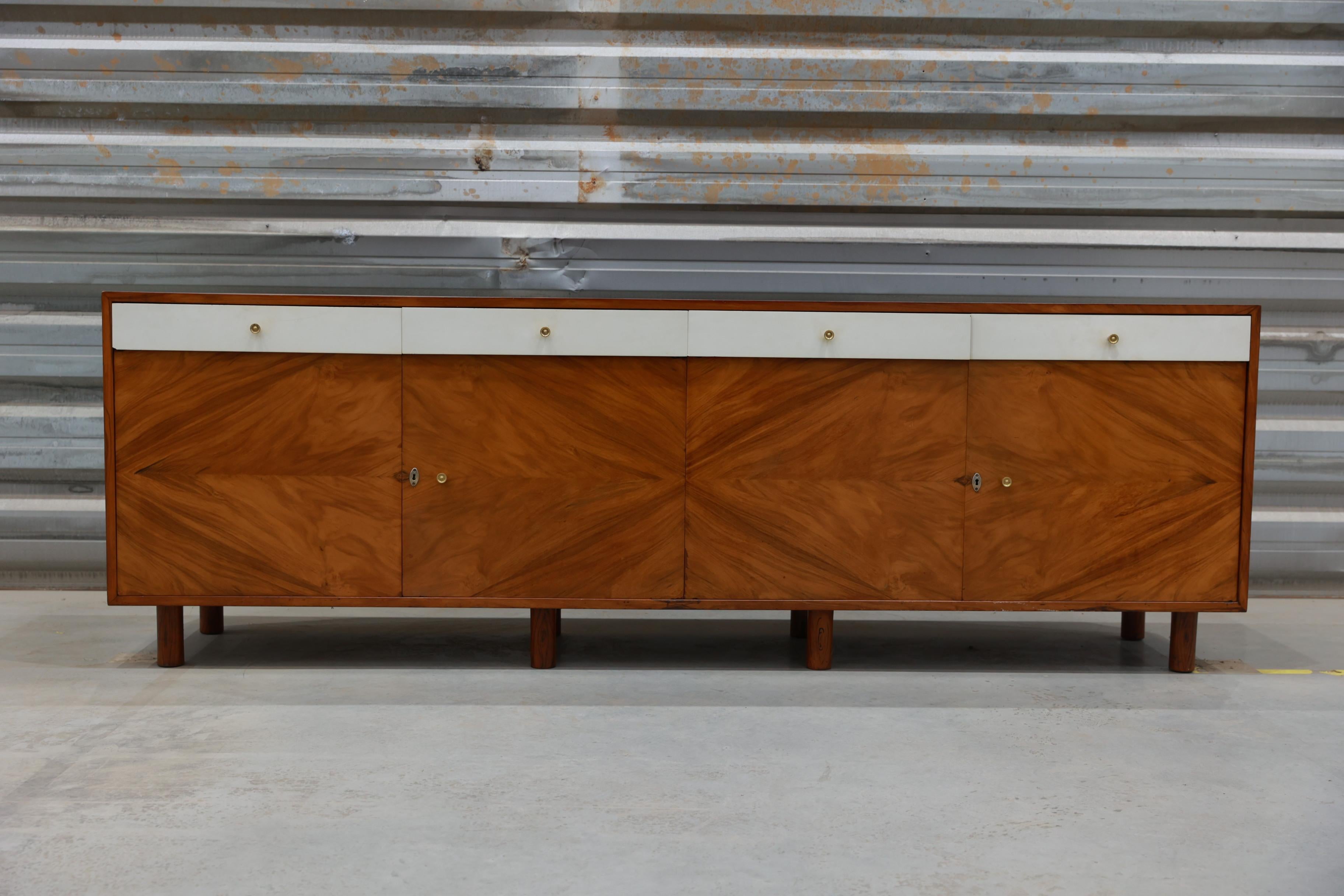 Available TODAY in NYC with free shipping included, this Credenza in Hardwood and Brass, Ernesto Hauner, c. 1960s is nothing less than a beauty!

This spectacular mid-century modern credenza is made with the finest Caviuna wood, and it is composed