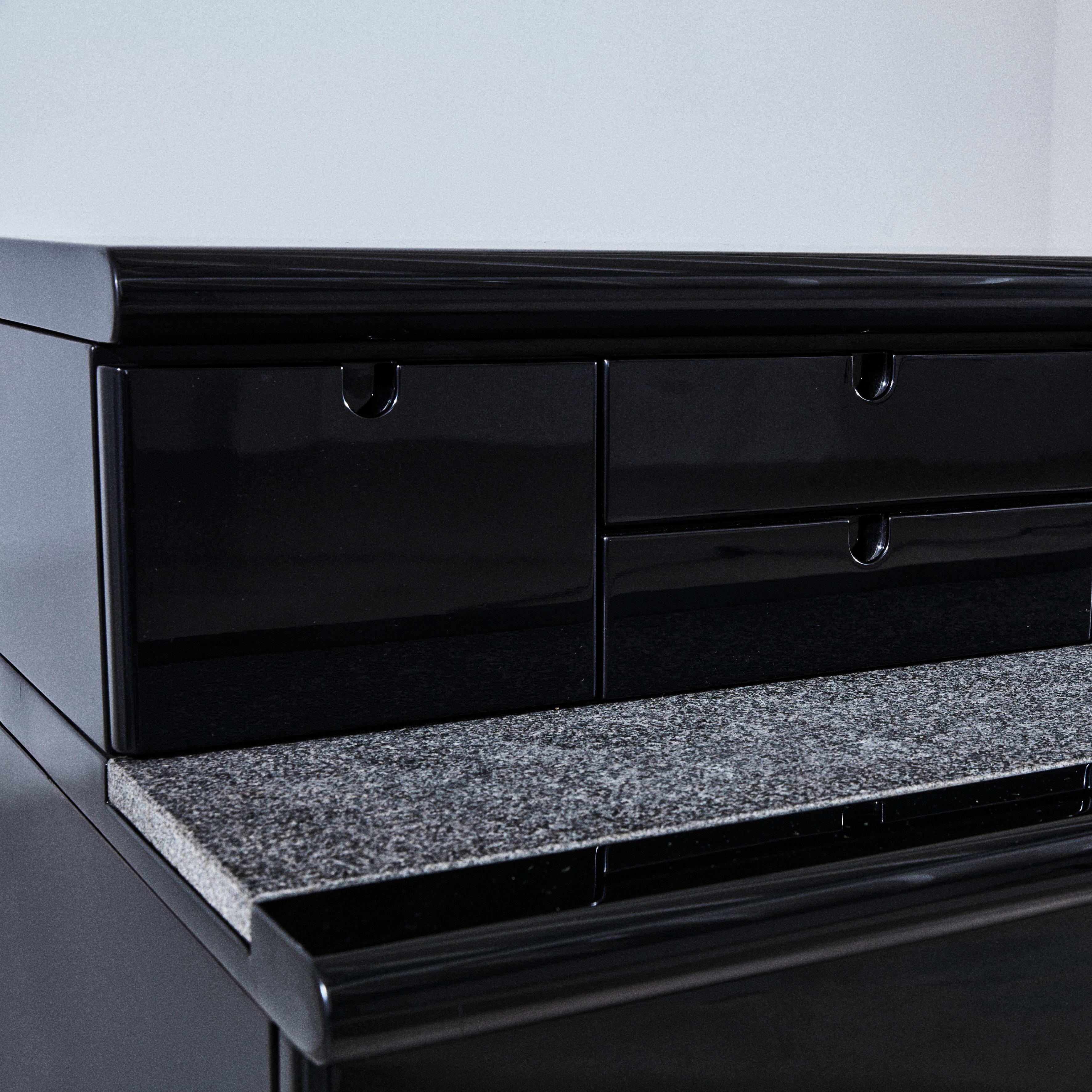 Mid-Century Modern Black lacquered wood and stone sideboard. Drawing Guido Faleschini For Sale