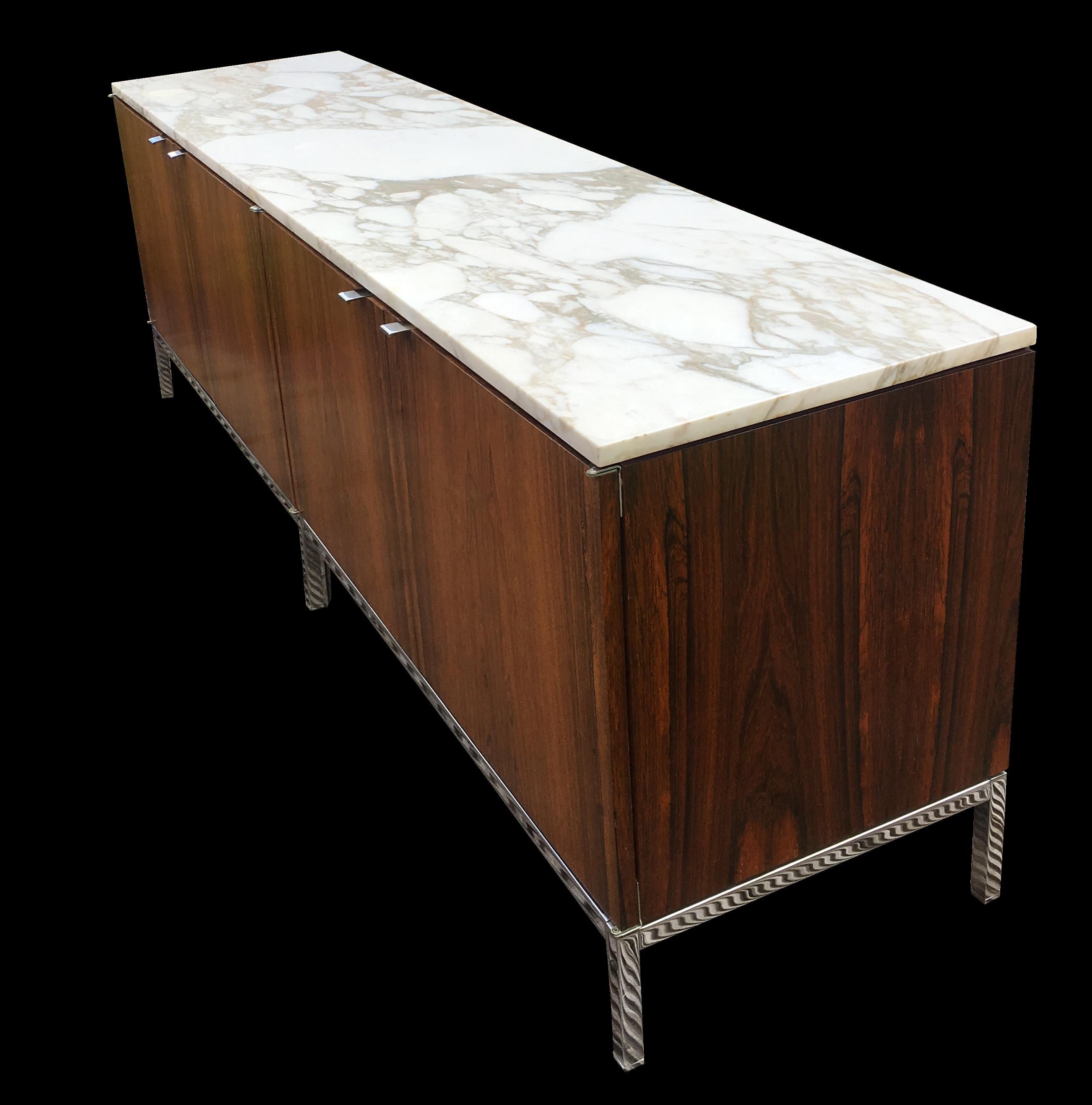 A very good original example of this ultra cool Classic midcentury Credenza, rosewood veneers, the original Calacutta marble top and all interior shelves in place.