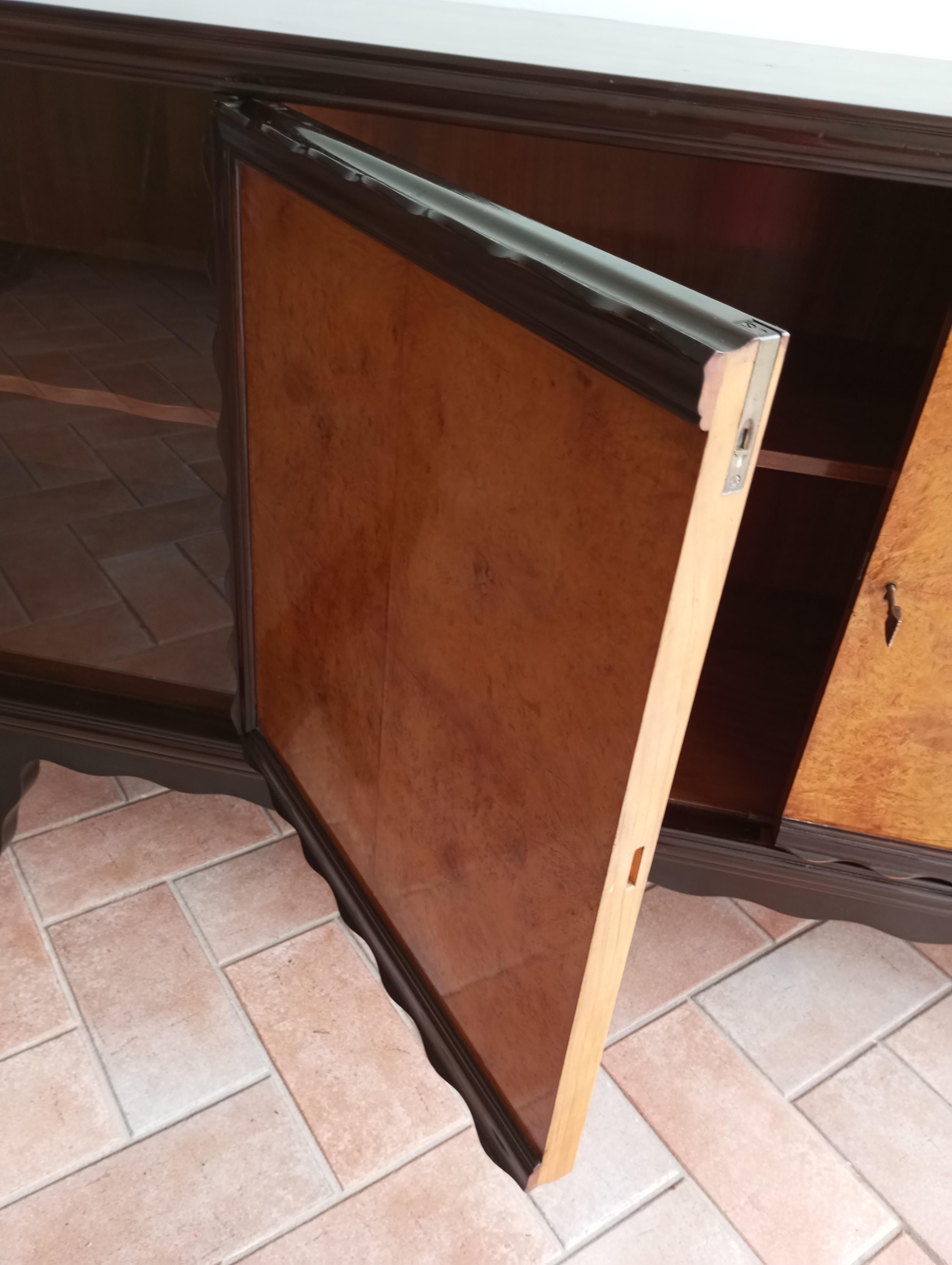 Wood Italian oak sideboard with sliding glass doors. For Sale