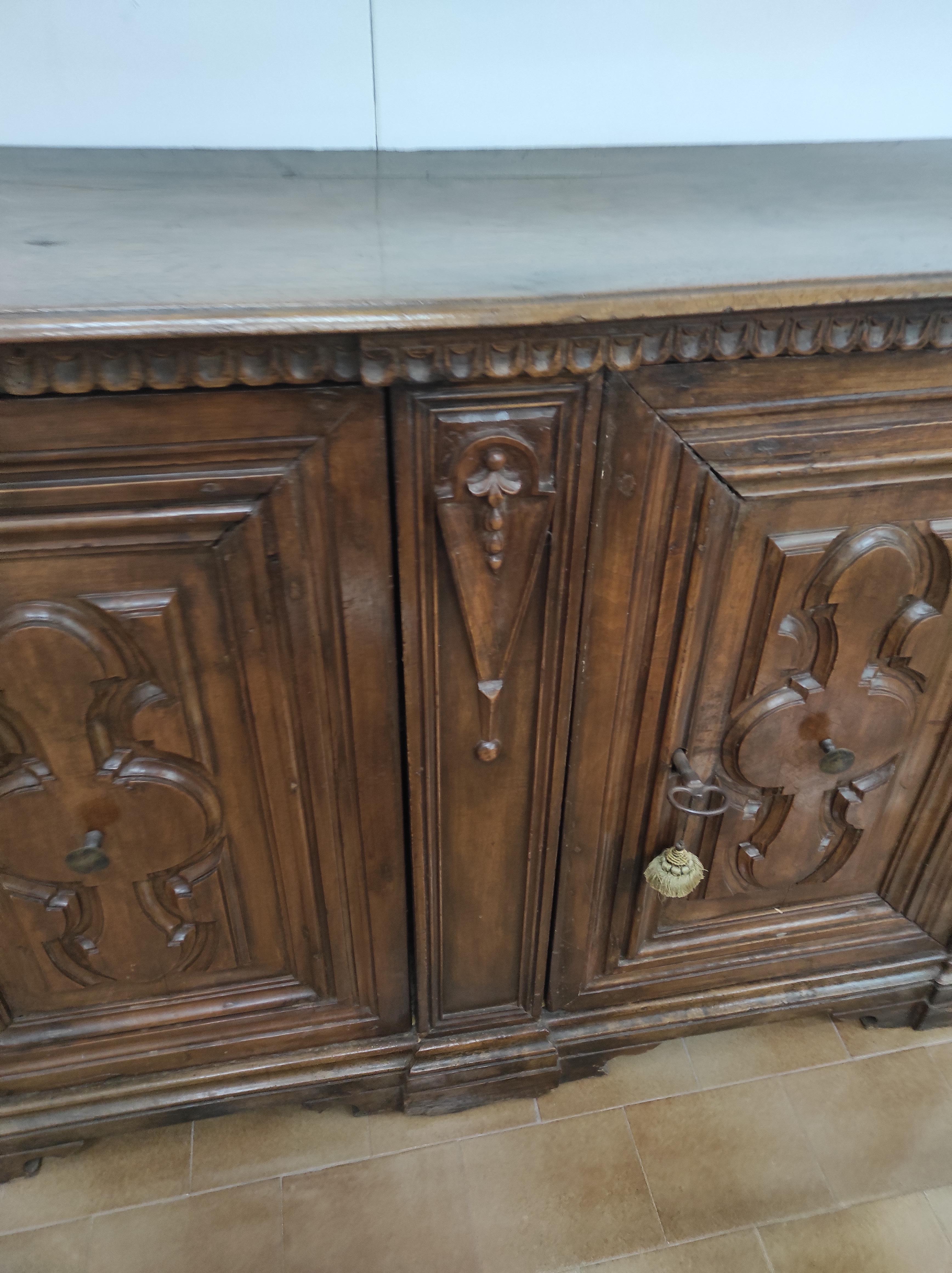 Nutwood Italian carved sideboard For Sale