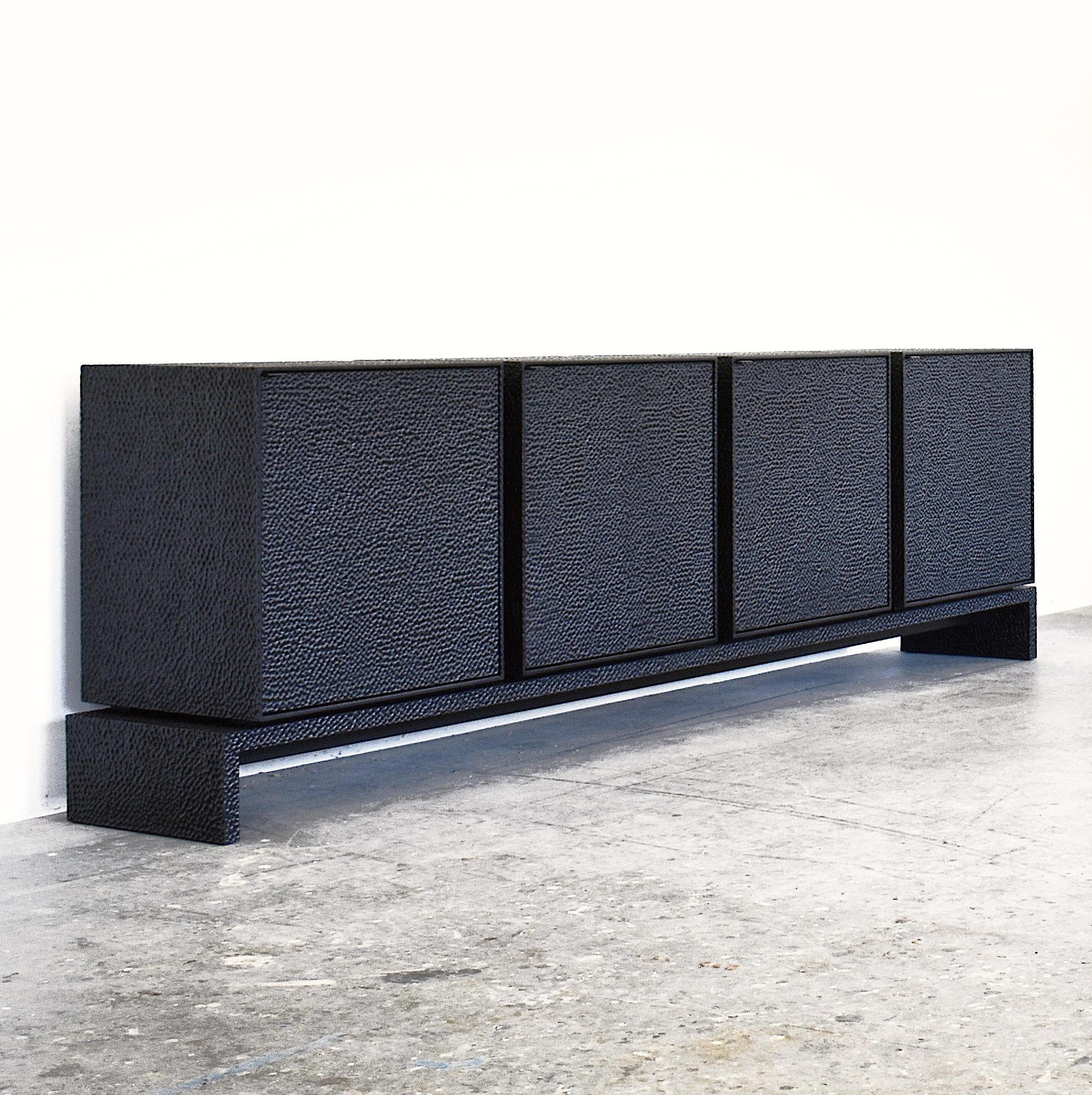 Credenza sculpted by John Eric Byers
Dimensions: 81.3 x 274.3 x 45.7 cm
Materials: Carved blackened maple, brass

All works are individually handmade to order.

John Eric Byers creates geometrically inspired pieces that are minimal, emotional,