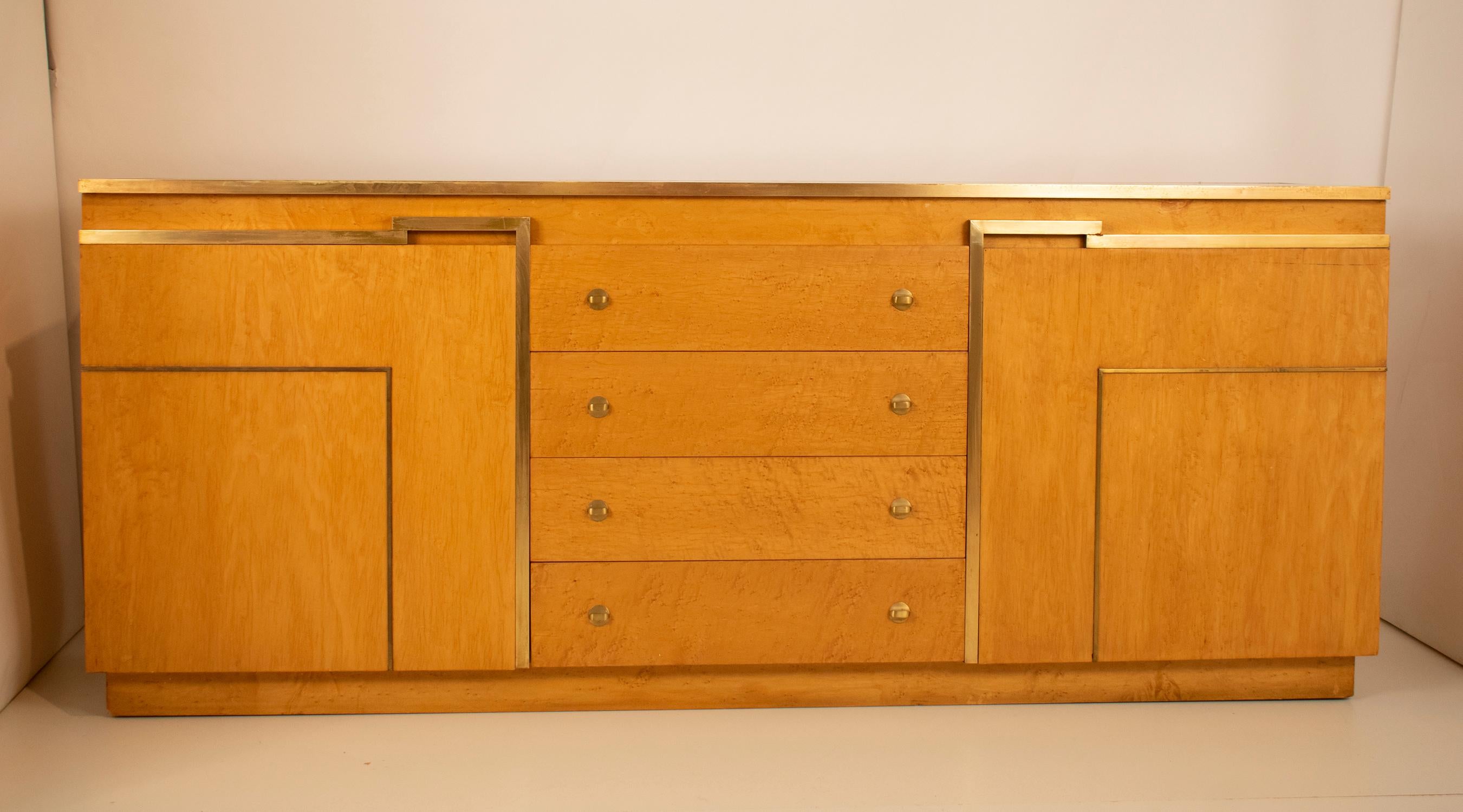 Sideboard by Jean Claude Mahey for Roche Bobois, circa 1970
In light wood and brass. Has a real back and can be used as room divider.