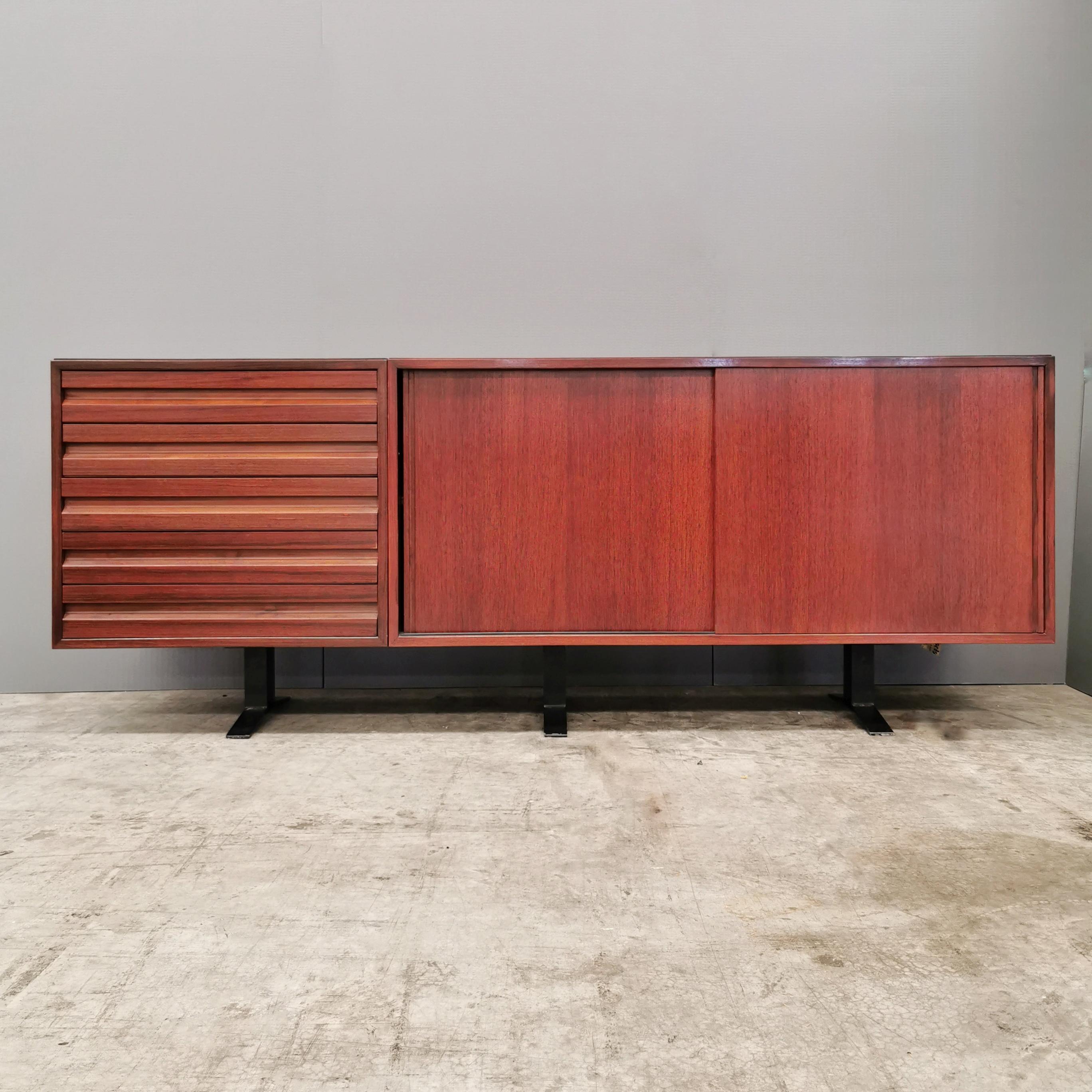 Sideboard Sideboard in Rosewood with Drawers and Double Sliding. Tecno production 1960s based on a design by Osvaldo Borsani. the cabinet is in excellent condition.