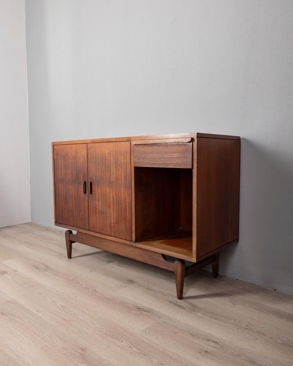 Two-door wooden sideboard with black metal handles and drawer, Italian design, 1960s.

CONDITION:
In good condition, shows signs of wear given by time.

SIZING: 
Height 82 cm; width 120 cm;  Length 45 cm;  

MATERIALS: 
Wood and Metal

YEAR