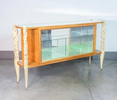 Sideboard, display case LA PERMANENTE MOBILI CANTÙ, carved wooden legs. 1940s