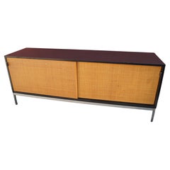 Credenza with Cane Doors and Black Laminate Case by Florence Knoll