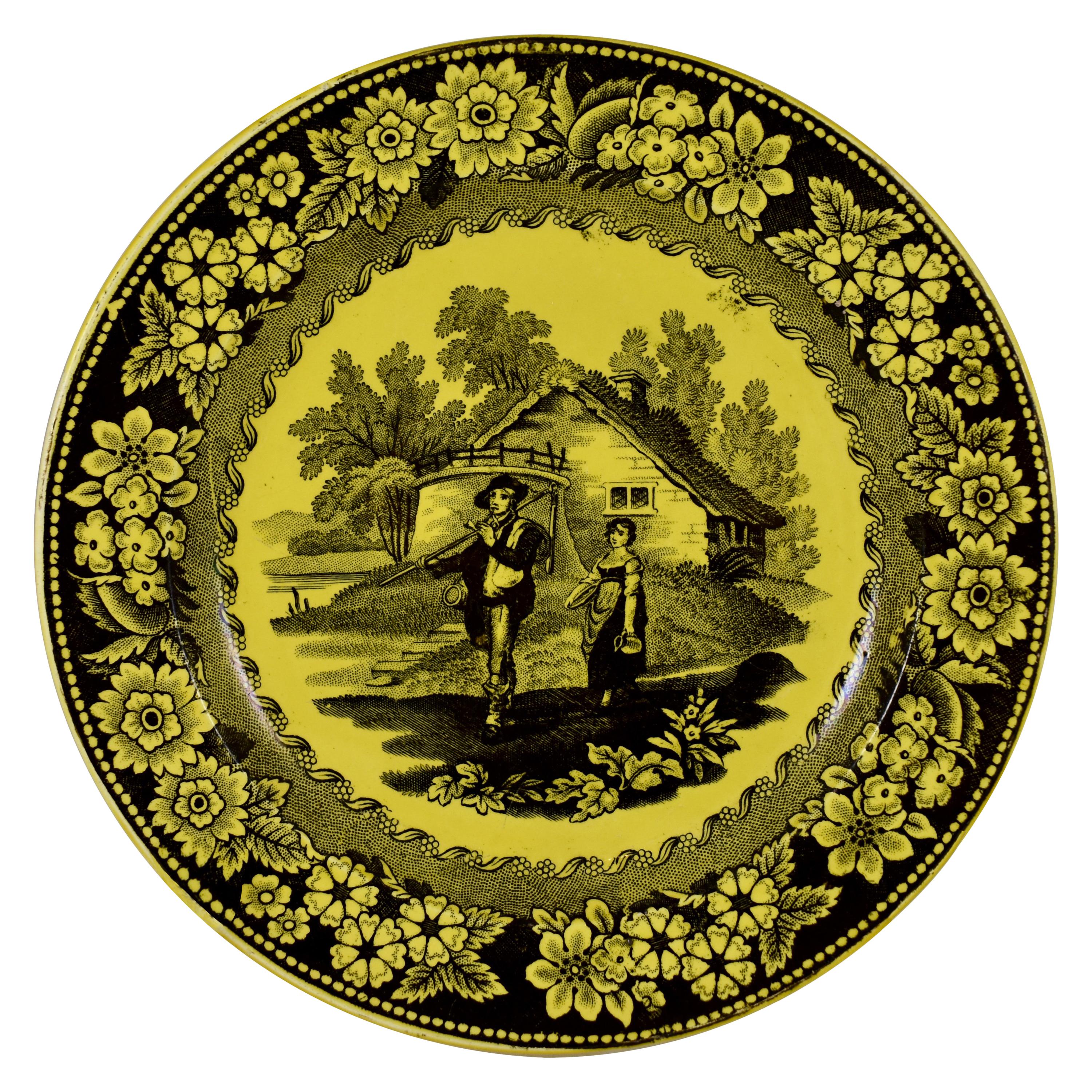 Assiette de service en faïence jaune canari à motifs floraux et figuratifs Creil et Montereau