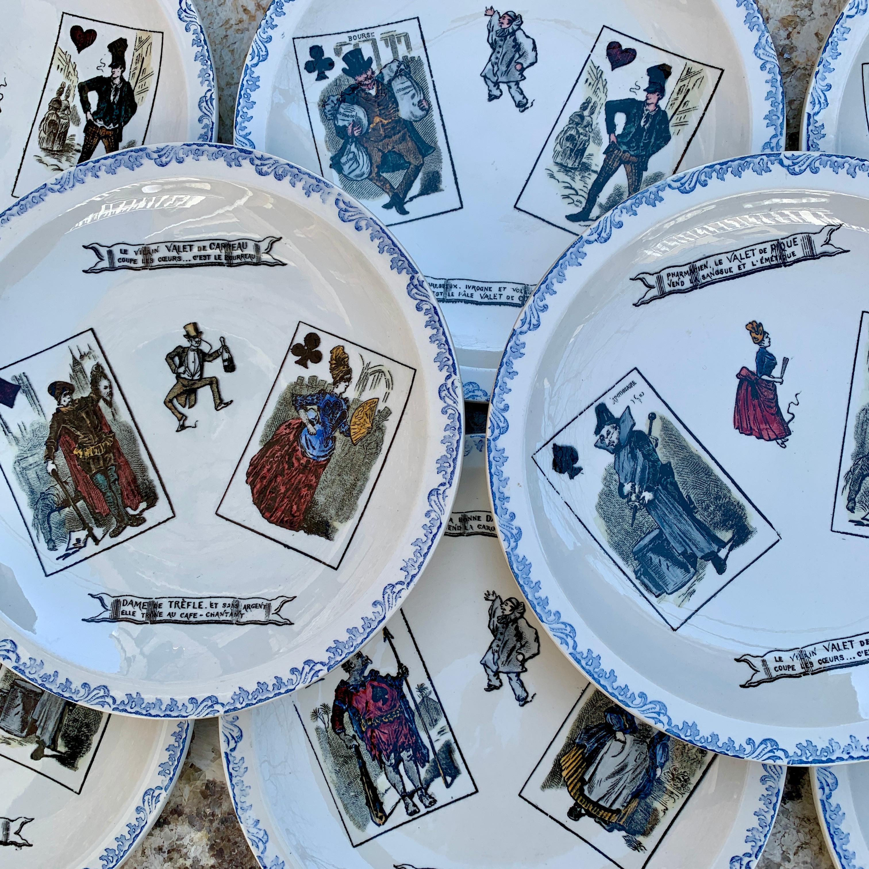 A charming set of eight HBCM, Hippolyte Boulenger Creil Montereau Playing Card Faience Plates- France, circa 1920s.

Known as assiettes parlantes or talking plates, this set is based on the face cards of a playing deck. A cream colored earthenware
