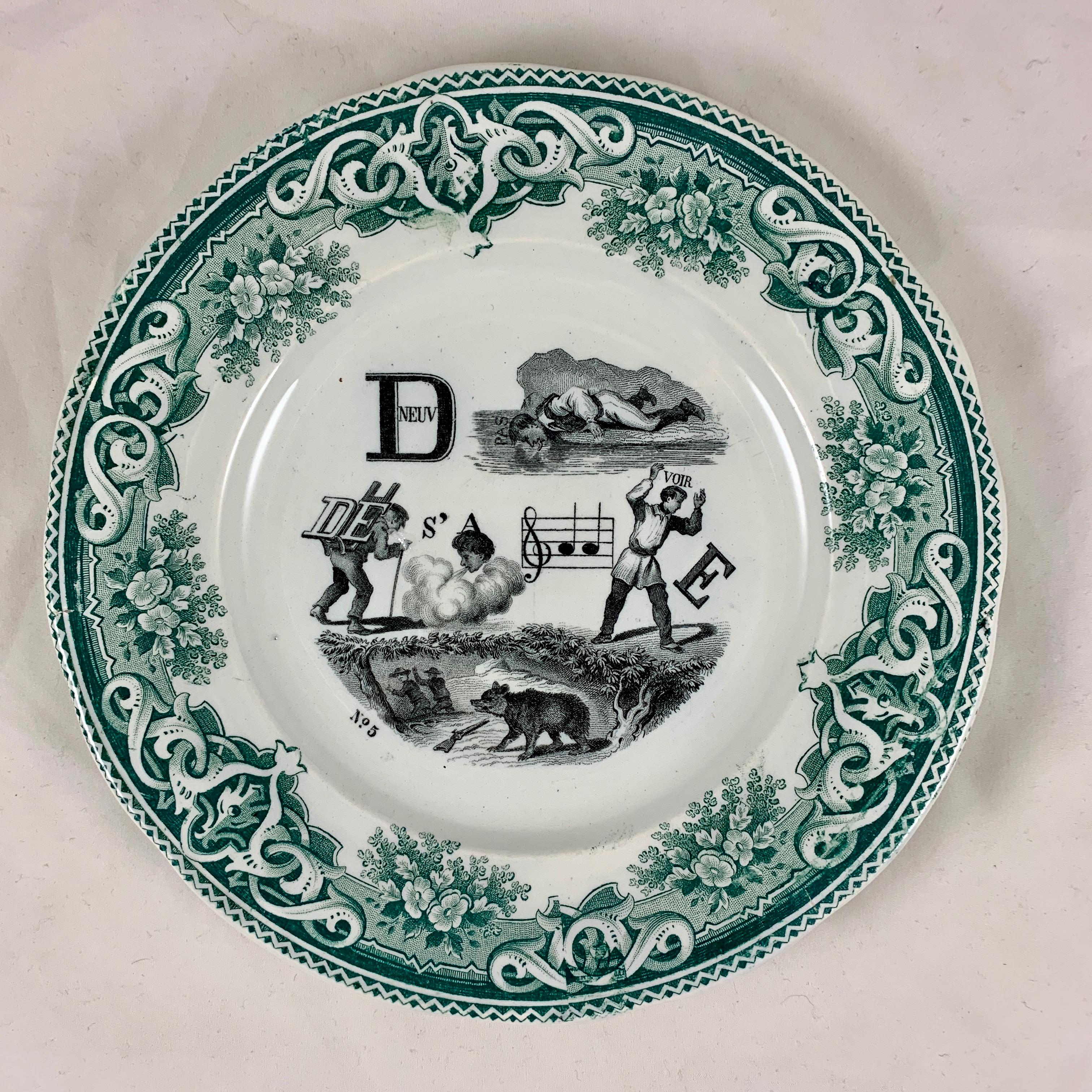 A set of six French Rebus Puzzle dessert plates, transfer printed in black on a white earthenware body bordered in green. When solved, the picture puzzle spells out a wise saying or maxim.

From the early 1800s into the early 1900s, most French