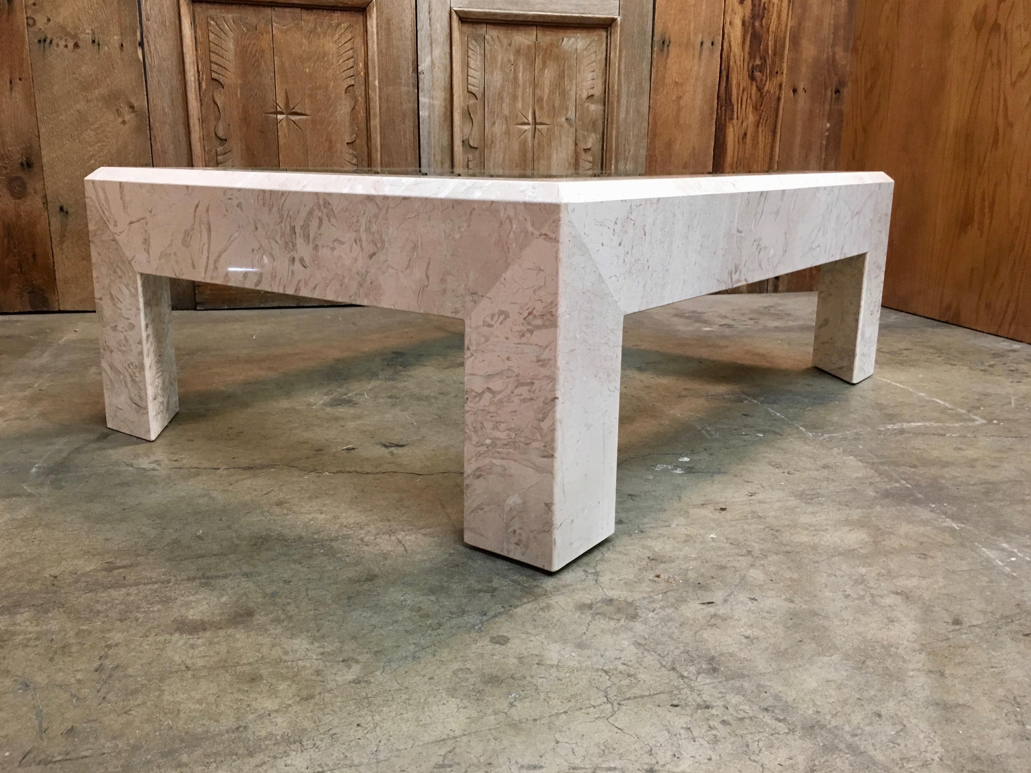 1980s massive marble cocktail table with beveled glass center insert.