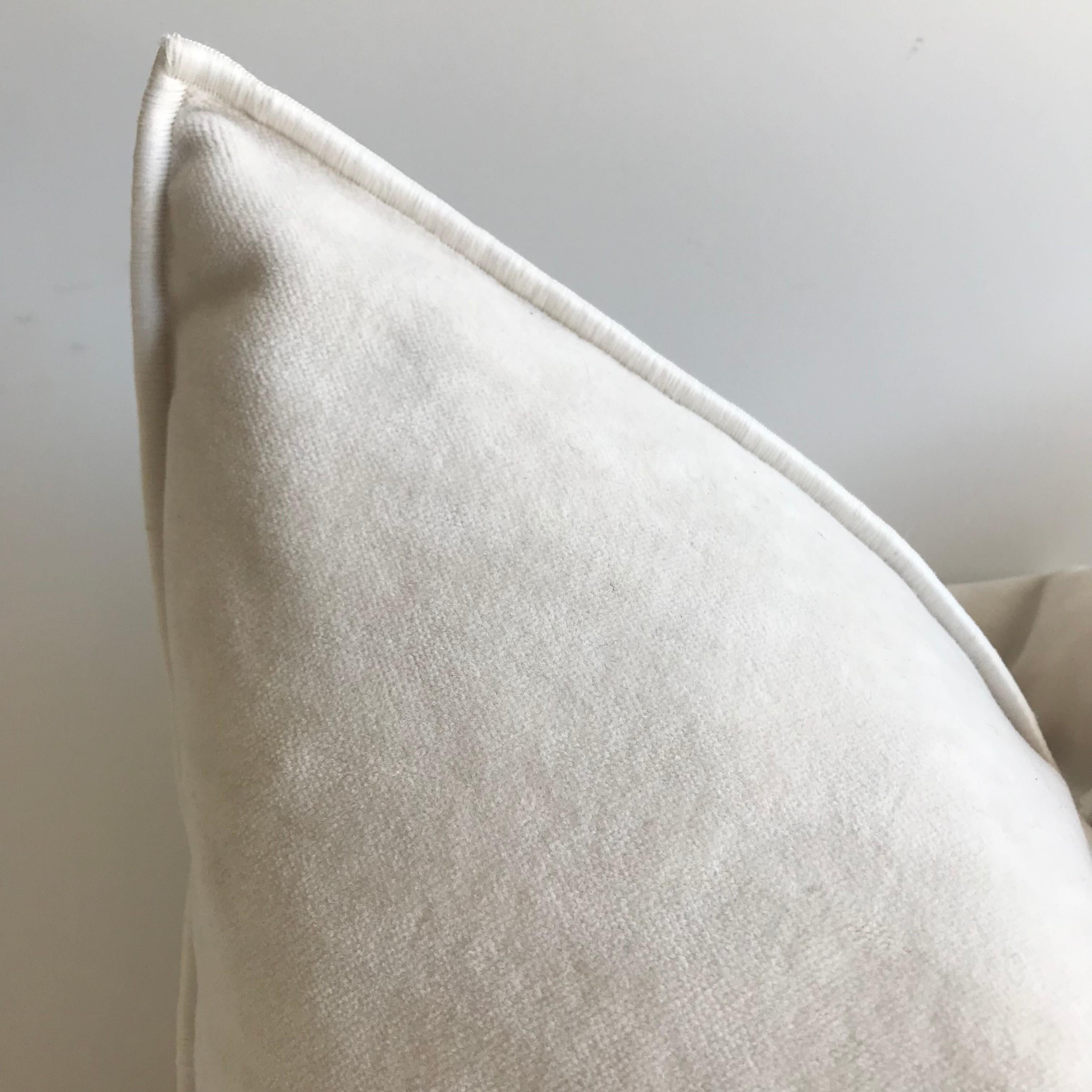 Beautiful French soft cream/white velvet pillow with binded edge. Metal zipper closure, and leather pull. Custom made in Paris, France. If this is backordered, please allow 6-8 weeks for production. Includes down feather insert.