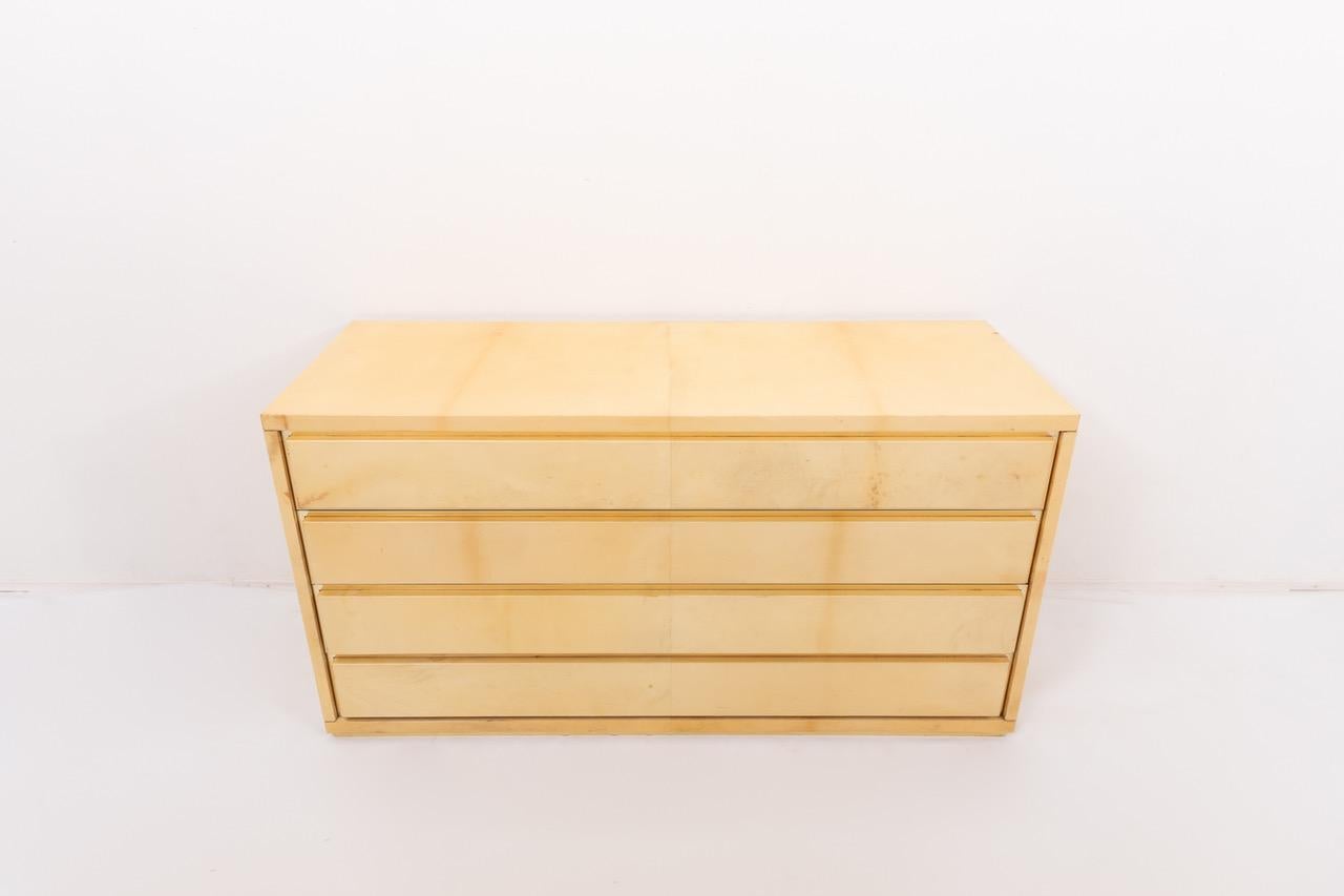 Stunning Italian modern dresser from Aldo Tura. This exceptional piece is executed in lacquered goatskin parchment with refined brass detailing.
Age related wear and usage marks.
This chest of drawers will ship from France and can be returned to