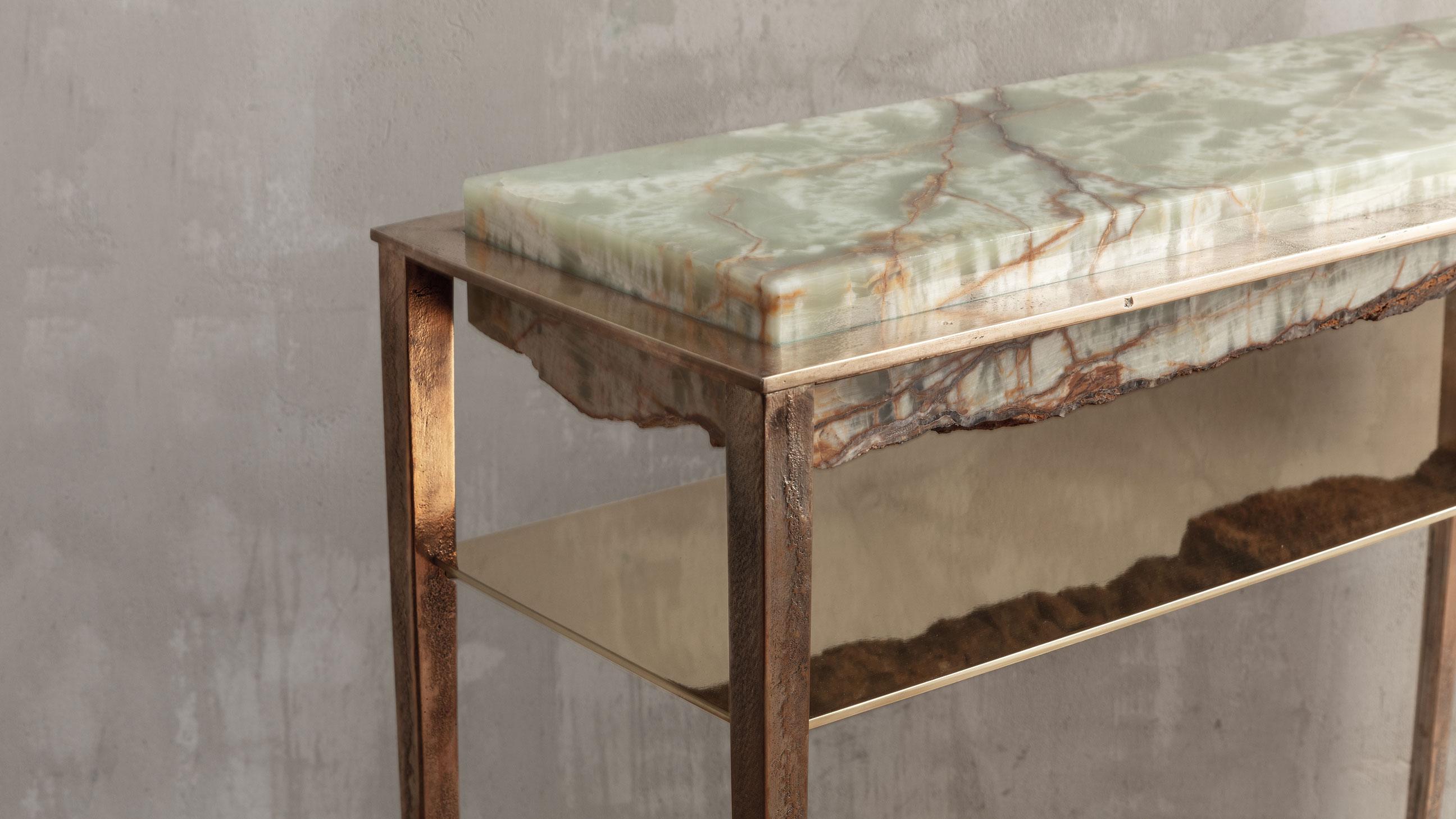 Each of these unique tables by acclaimed artist and master-craftsman, Gianluca Pacchioni, is handcrafted at the sculptor's studio in Milan. Slabs of individually sourced and hand-hewn green onyx are suspended mid-air by uncannily thin legs. 

A