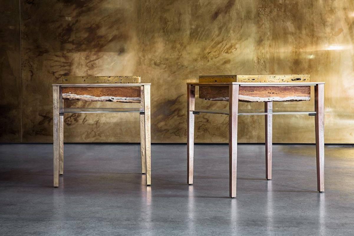 Each of these unique tables by acclaimed artist and master-craftsman, Gianluca Pacchioni, is handcrafted at the sculptor's studio in Milan. Liquid brass is poured onto raw slabs of red Persian travertine and suspended mid-air by uncannily thin legs.