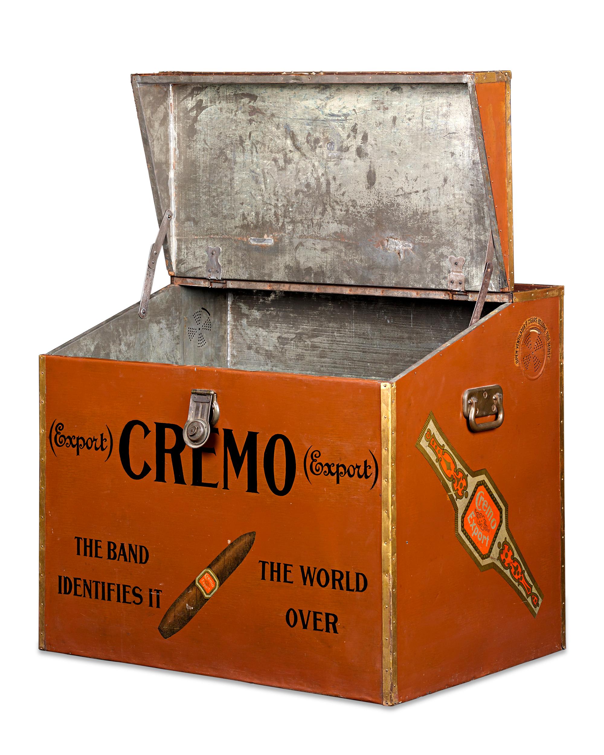 This monumental humidor trunk was made by Cremo Cigars to house and advertise the company's famed cigars in tobacco shops. The trunk remains in fantastic condition, featuring a polychrome exterior and Cremo's logo and famed slogan 