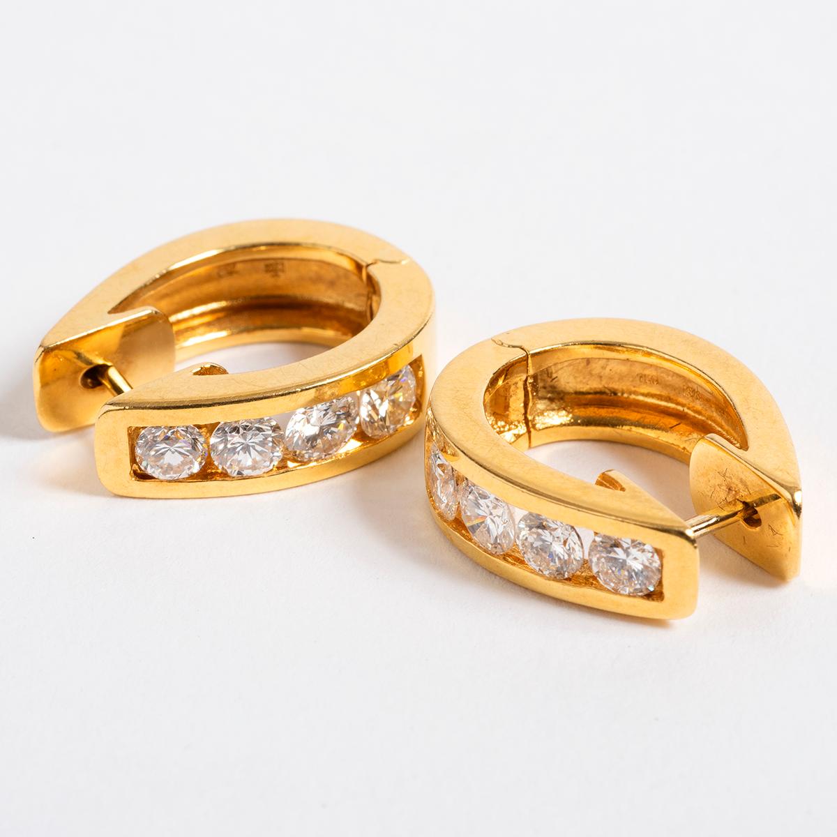 A unique piece within our carefully curated Vintage & Prestige fine jewellery collection, we are delighted to present the following:

Our prominent creole cuff earrings in 18k yellow gold measure 2cm x 1.5cm x .5cm feature set 1.6ct of fiery est. F