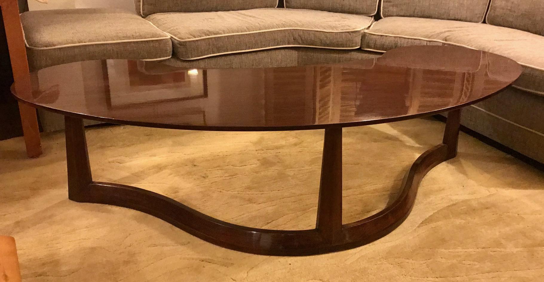 Widdicomb Furniture Company

Crescent shape midcentury coffee table with tripod serpentine base and tapered legs.

Date of manufacture 1960.