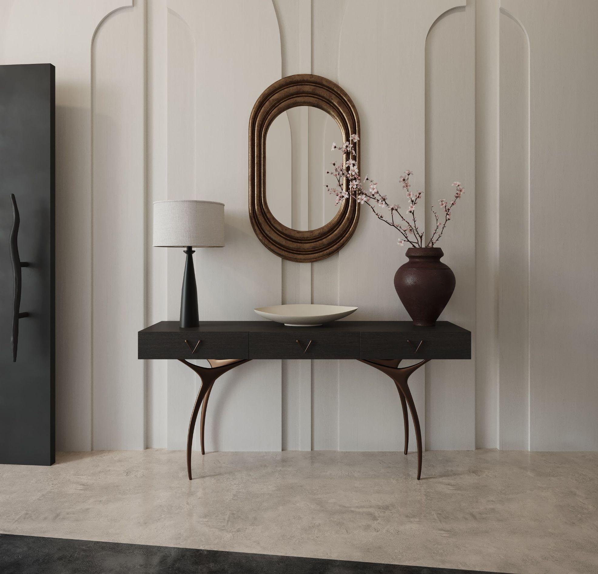 Introducing the Crescent Console Table, a masterpiece of modern craftsmanship designed by Carlos Solano, founder of Stamford Modern. This elegant piece seamlessly blends form and function. Adorned with solid brass legs in our exquisite orb