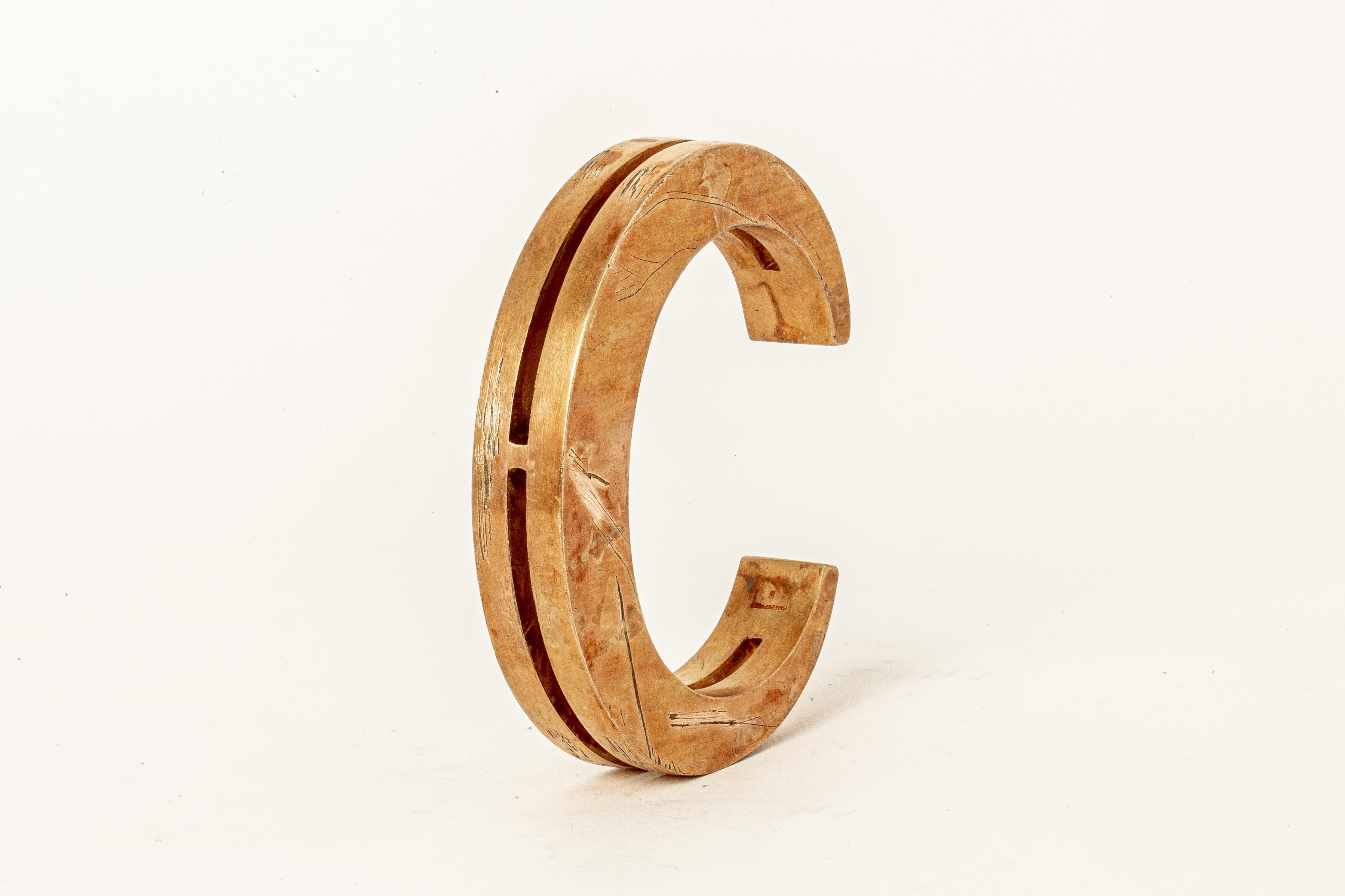 Bracelet in brass. Brass substrate is electroplated with 18k Rose Gold and then dipped into acid to create the subtly destroyed surface. This piece is 100% hand fabricated from metal plate; cut into sections and soldered together to make the hollow