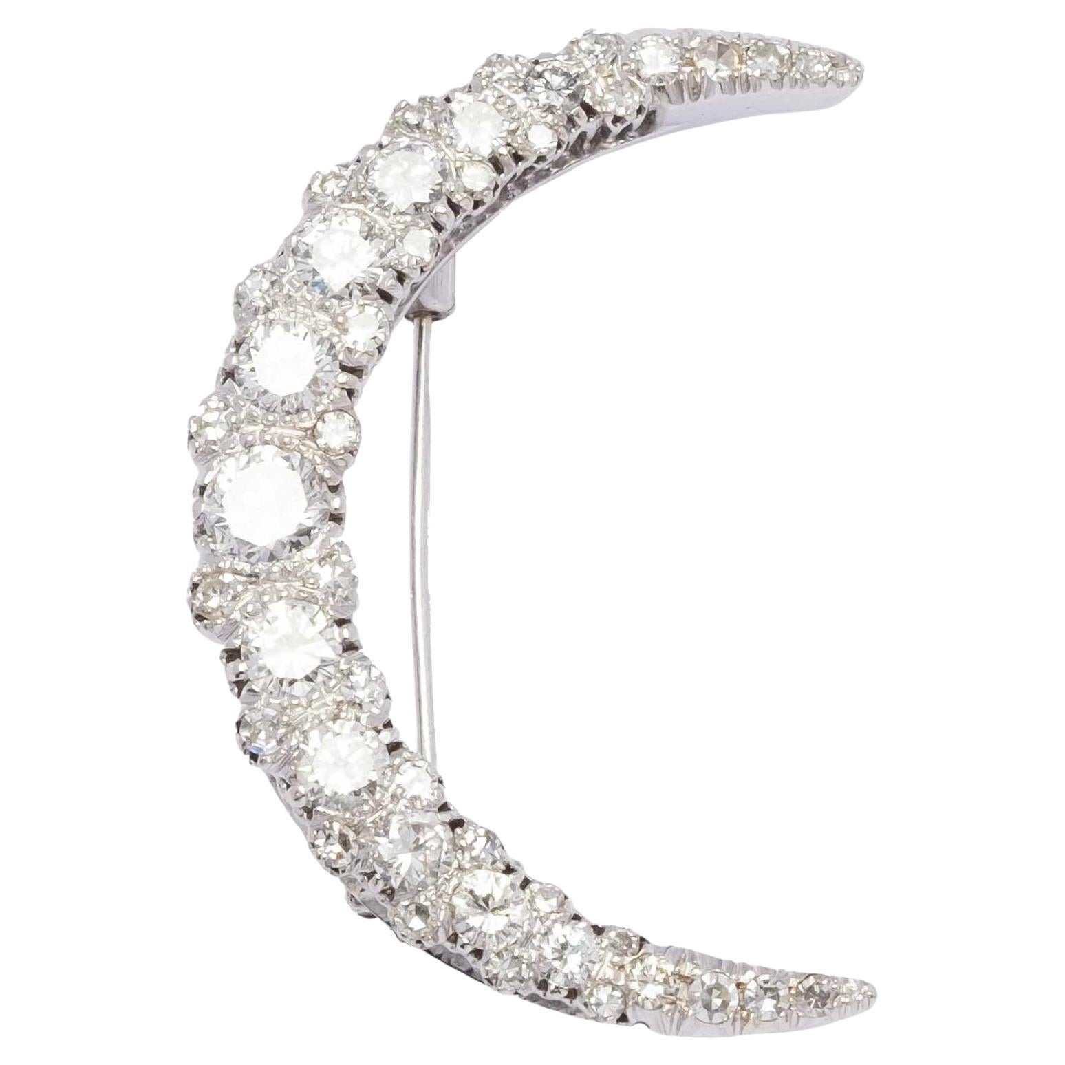 Crescent moon brooch with diamonds