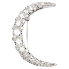 Crescent moon brooch with diamonds