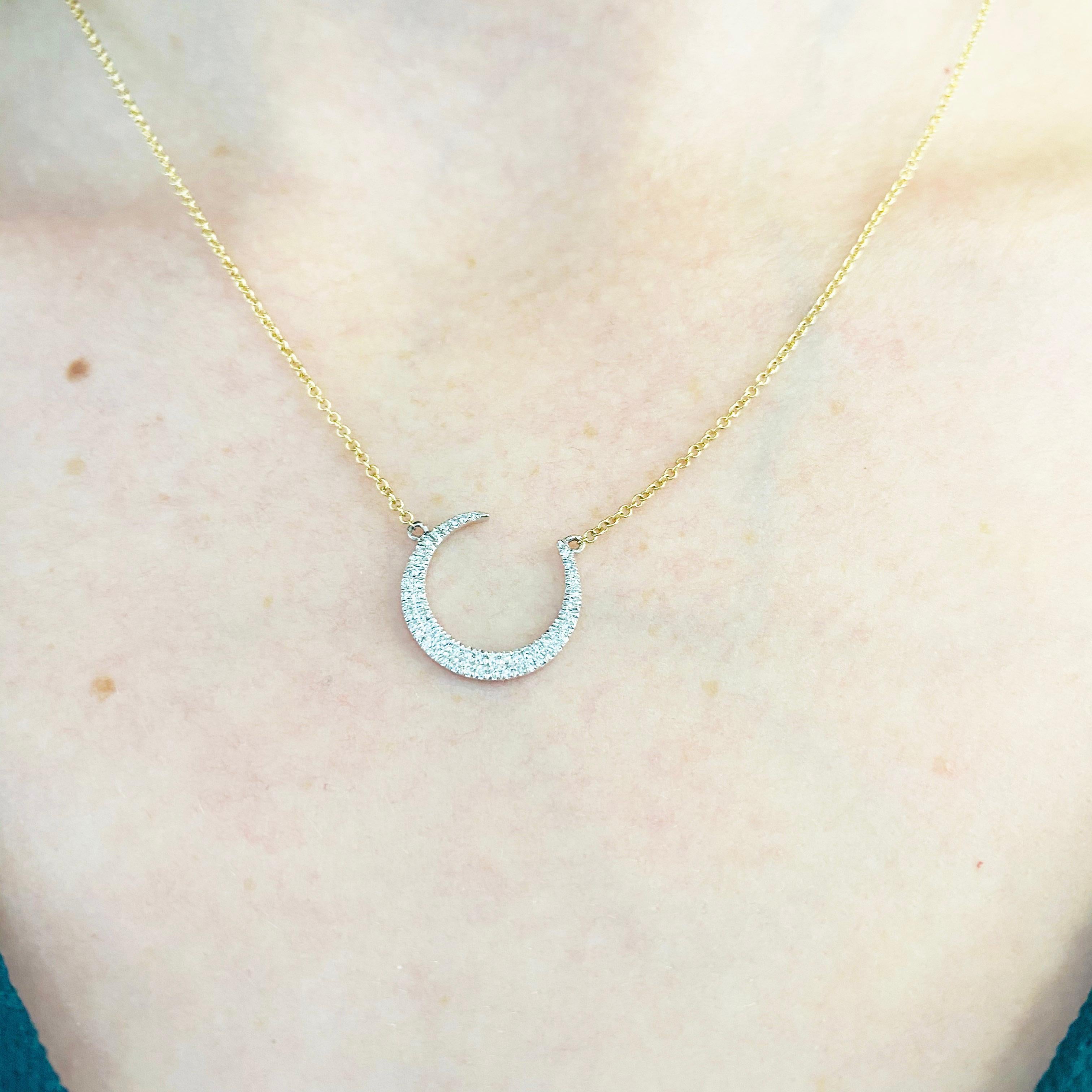 This gorgeous 14k white and yellow gold crescent moon pendant dripping with diamonds is the perfect mix between classic and trendy! This necklace is very fashionable and can add a touch of style to any outfit, yet it is also classy enough to pair