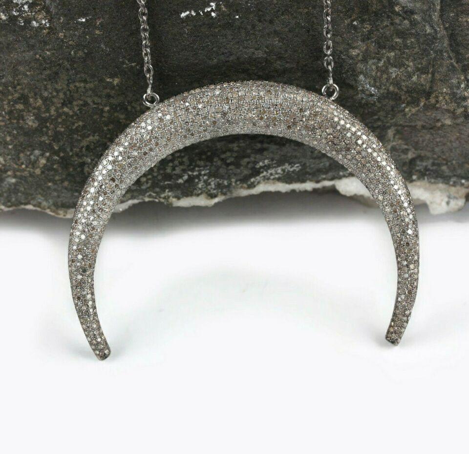 Crescent moon Pendant Pave Diamond 925 Silver Diamond Horn Pendant Christmas

Total wt 20 gram approx
Size 65mm x 45mm approx / 11inch chain
Size of chain can be more if u want plz massage whenu order and we will change your size
Diamonds 4.40 cts