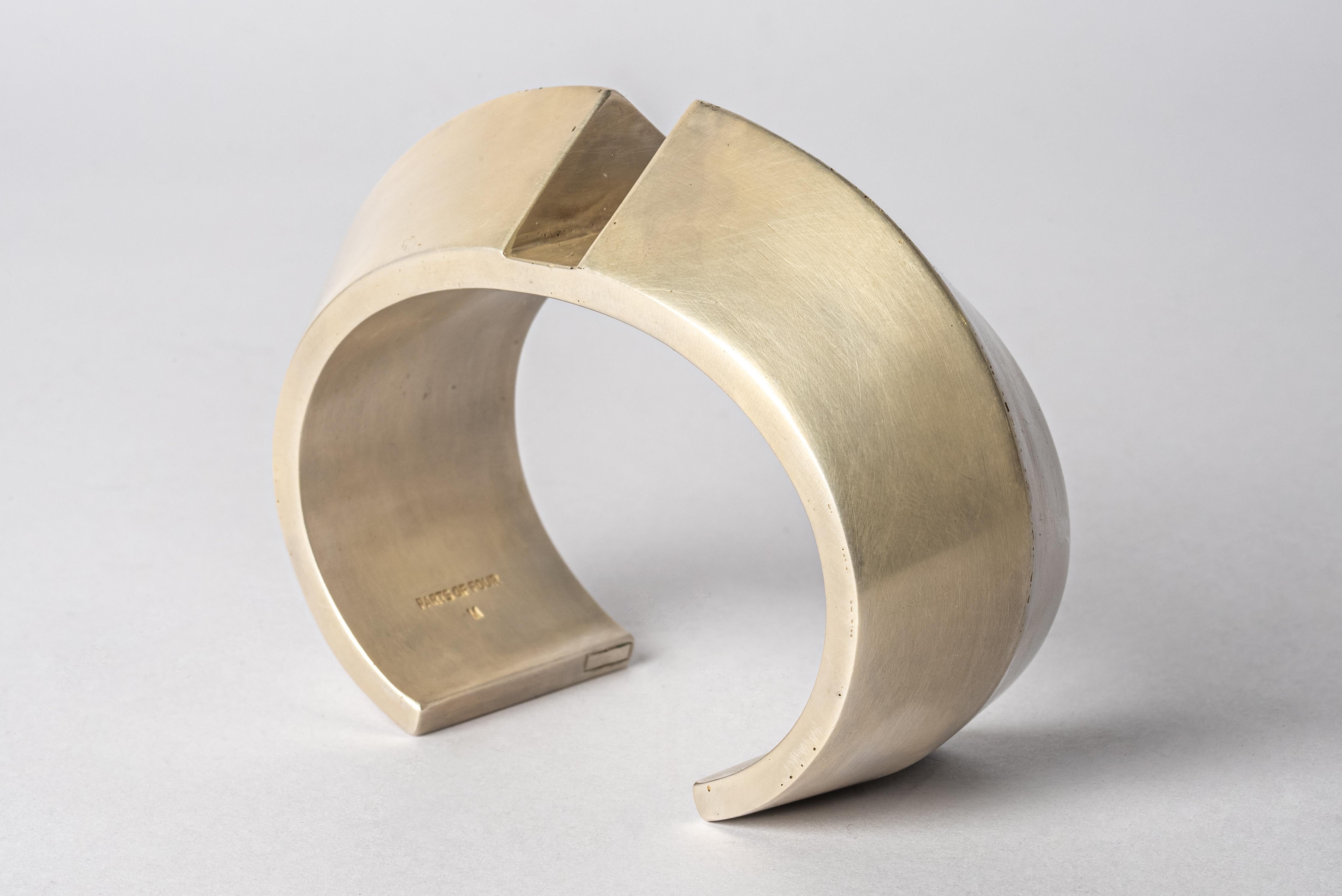 Bracelet in acid treated silver plated brass. This piece is 100% hand fabricated from metal plate; cut into sections and soldered together to make the hollow three dimensional form. If sterling silver, the sheet metal is made by hand. The silver is
