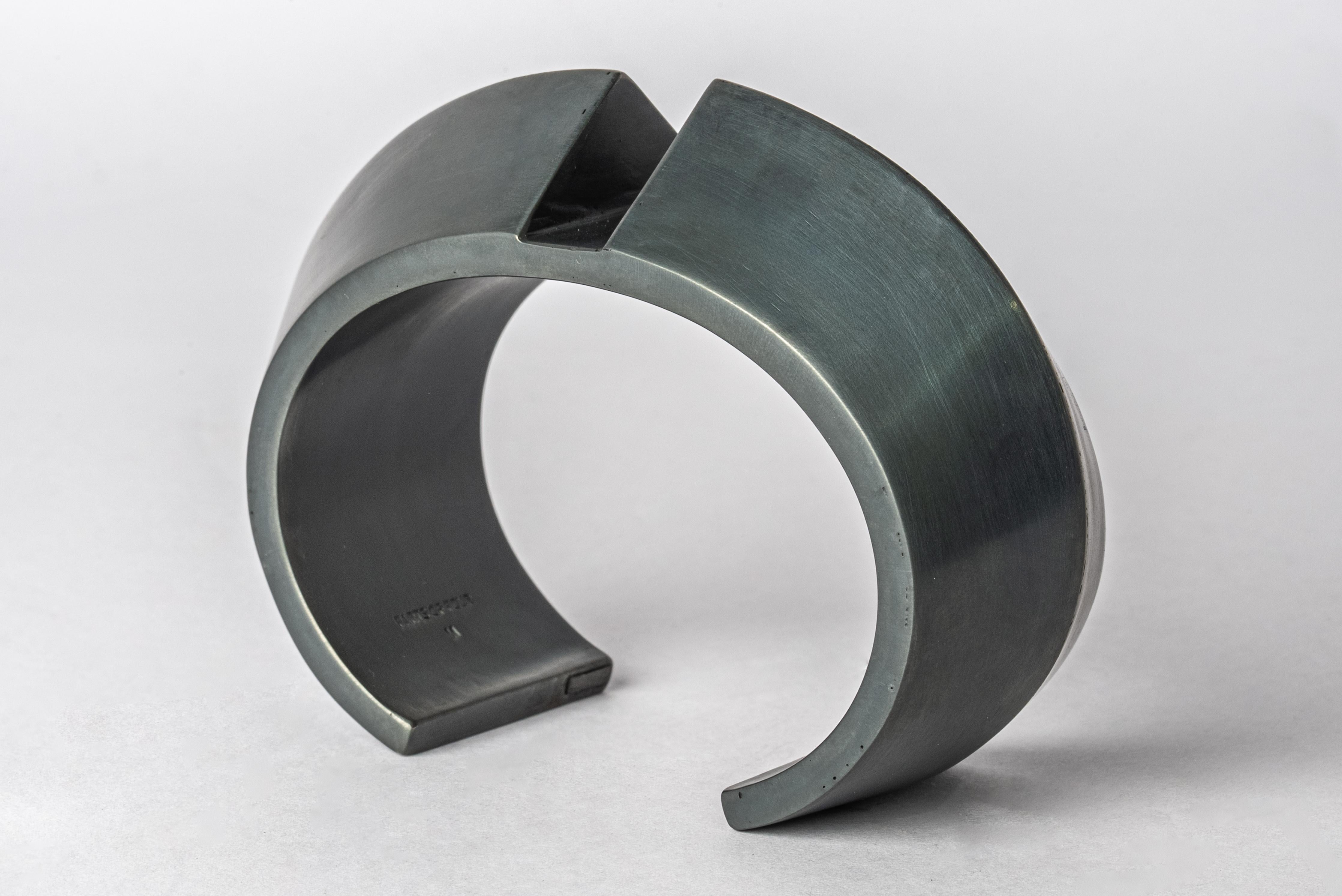 Bracelet in oxidized silver plated brass. This piece is 100% hand fabricated from metal plate; cut into sections and soldered together to make the hollow three dimensional form.