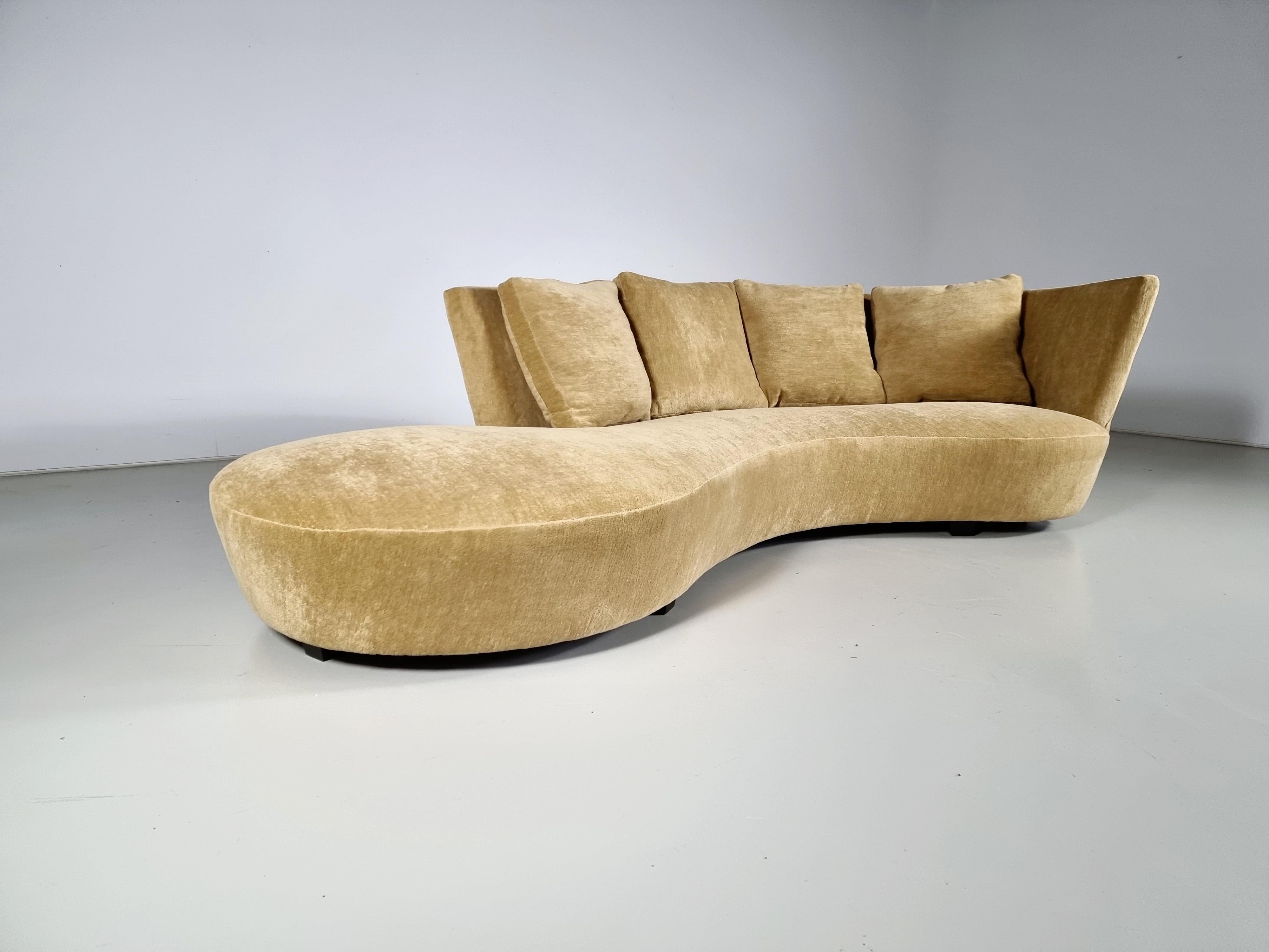 Crescent sofa, Vladimir Kagan, 

Fluid lines grow to new heights with the Crescent Sofa, designed as part of Kagan’s ever-evolving take on his iconic Serpentine forms.
Kagan’s signature tight seat upholstery, adorned with plush, feather-down