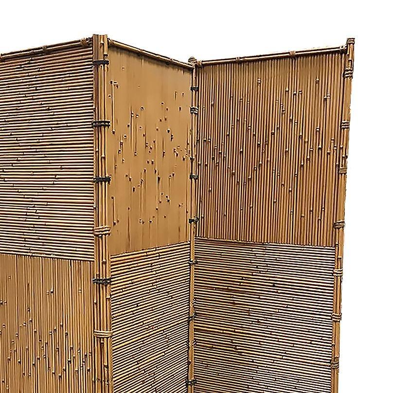 Original 1930 reed rattan room divider folding screen in the style of furniture by Gabriella Crespi. This stacked rattan folding room divider screen was 3 panels each 81