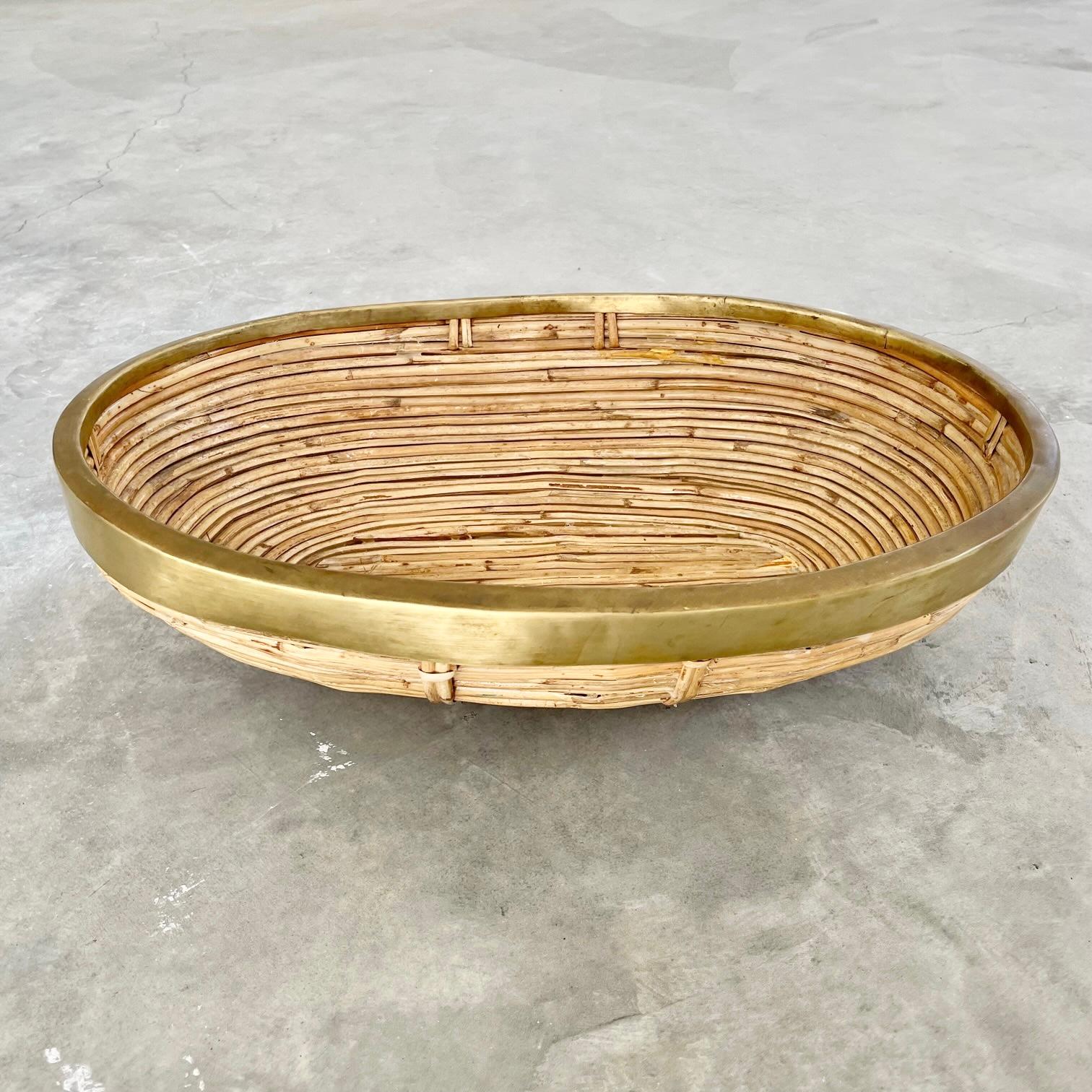 Elegant bamboo bowl with brass trim in the style of Crespi. Great texture. Bamboo pieces are woven together with wicker ties as well as glued together. Bowl is sturdy and is great to hold items as the base is supported by a rattan ring. Great piece