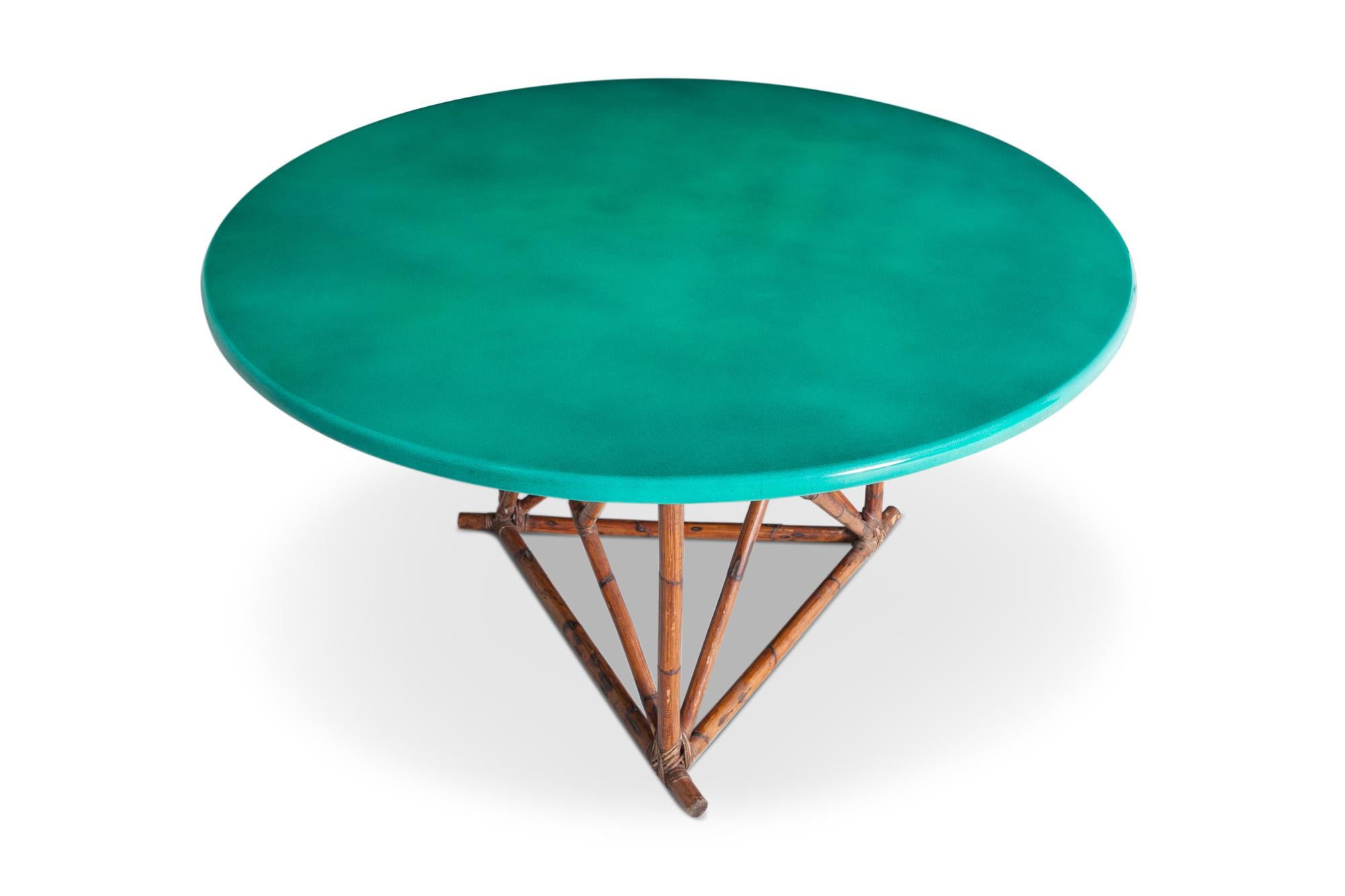 Lacquered chalk Italian dining table created for the famous Cassetti jewellery store in Florence, Italy. 

Truly a one-of-a-kind piece. The wonderful deep green lacquered top is supported by a lightweight bamboo frame. The richness of the green