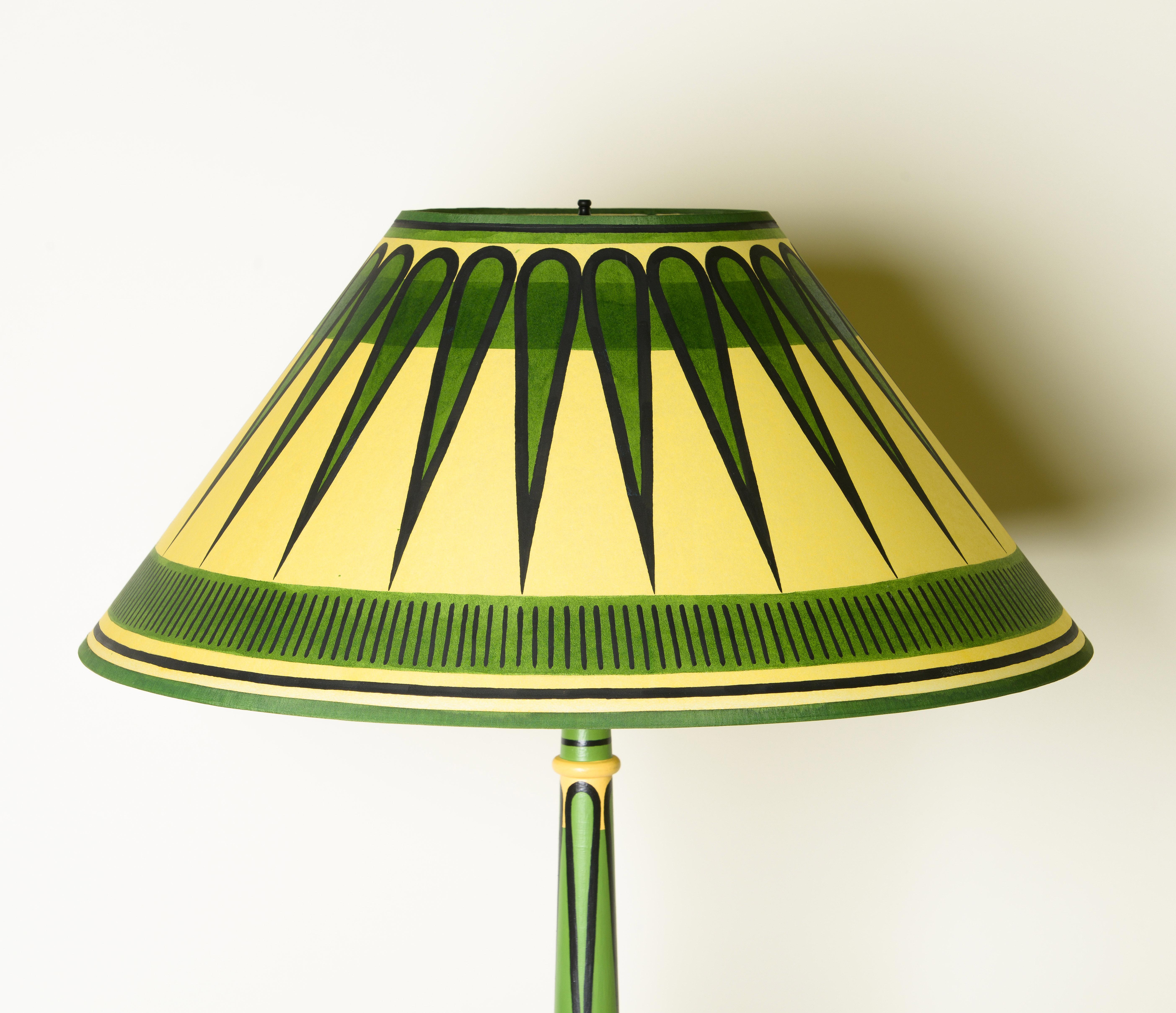 Hand-painted standing floor Lamp with matching shade wooden body  adorned with green, and black.

Cressida Bell is a British designer specialising in textiles and interiors. From her London studio, she produces a wide range of products including