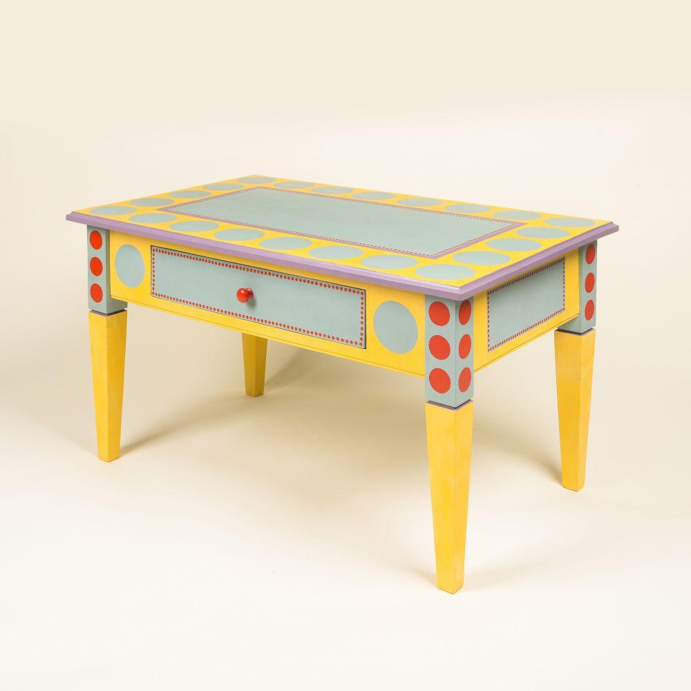 Hand-painted coffee table with a yellow base color adorned with light blue and red dots. Includes a single drawer and stands on four legs.
