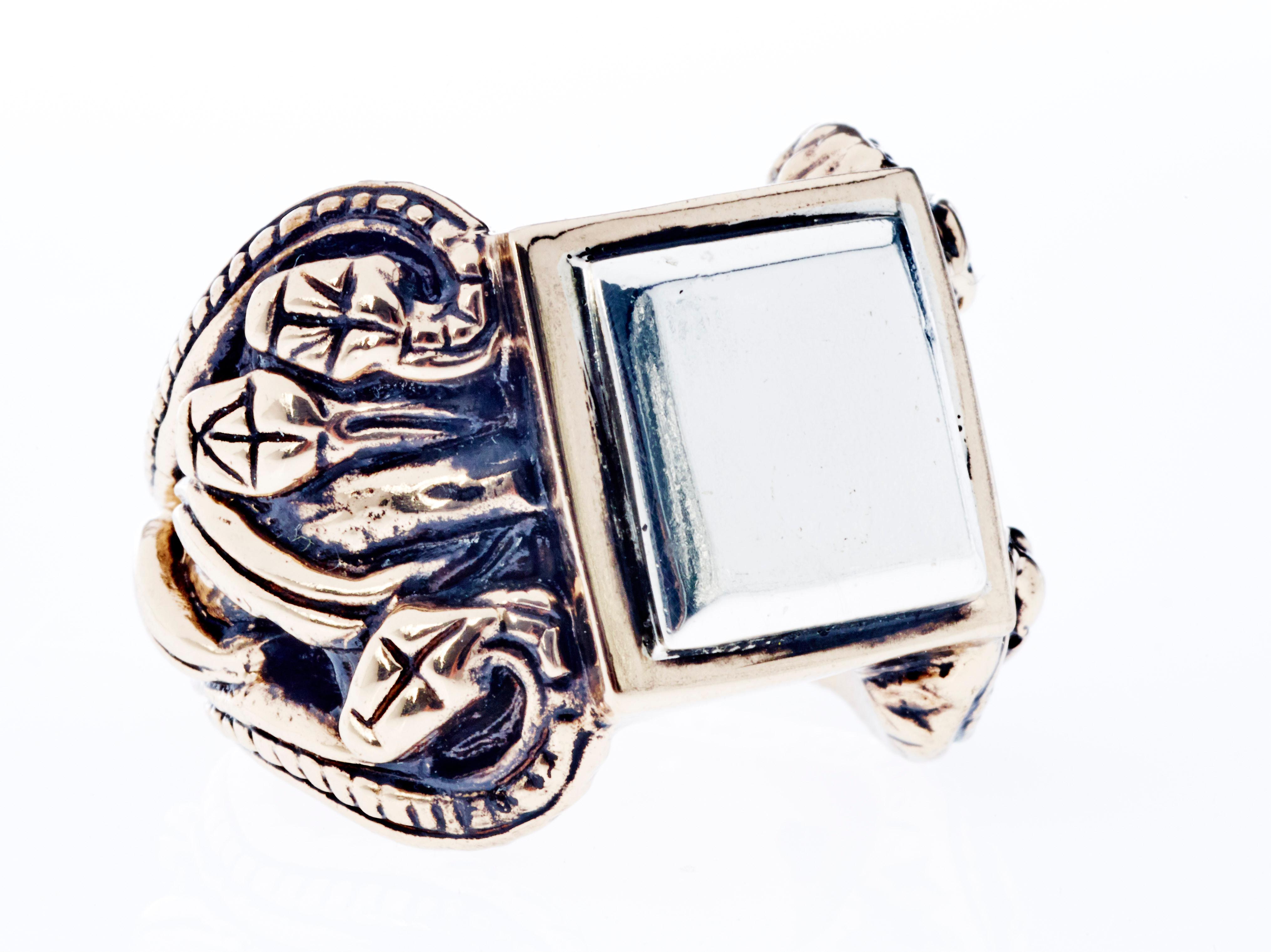 Crest Ring Silver Bronze Snake 

Designer: J Dauphin

J DAUPHIN statement ring made in Bronze and silver with antique plating.

The serpent, or snake, is one of the oldest and most widespread mythological symbols. 
Historically, serpents and snakes