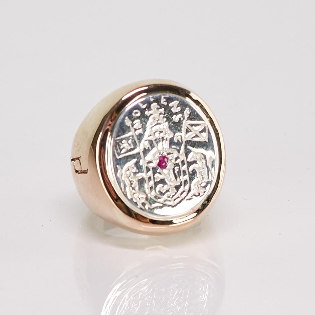 Crest Signet Ring Sterling Silver Bronze with Ruby gem in the middle of Crest ( can be replaced with Black or White Diamond ) J Dauphin can be worn by women or men.

Inspired by Queen Mary of Scots ring. signet-ring; engraved; shoulders ornamented