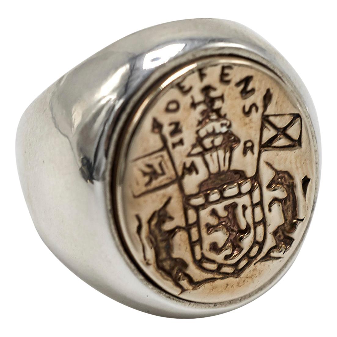 Crest Signet Ring 14k White Gold 14k Yellow Gold Unisex J Dauphin

Inspired by Queen Mary of Scots ring. Gold signet-ring; engraved; shoulders ornamented with flowers and leaves. Oval bezel set with silver intaglio depicting achievement of Mary