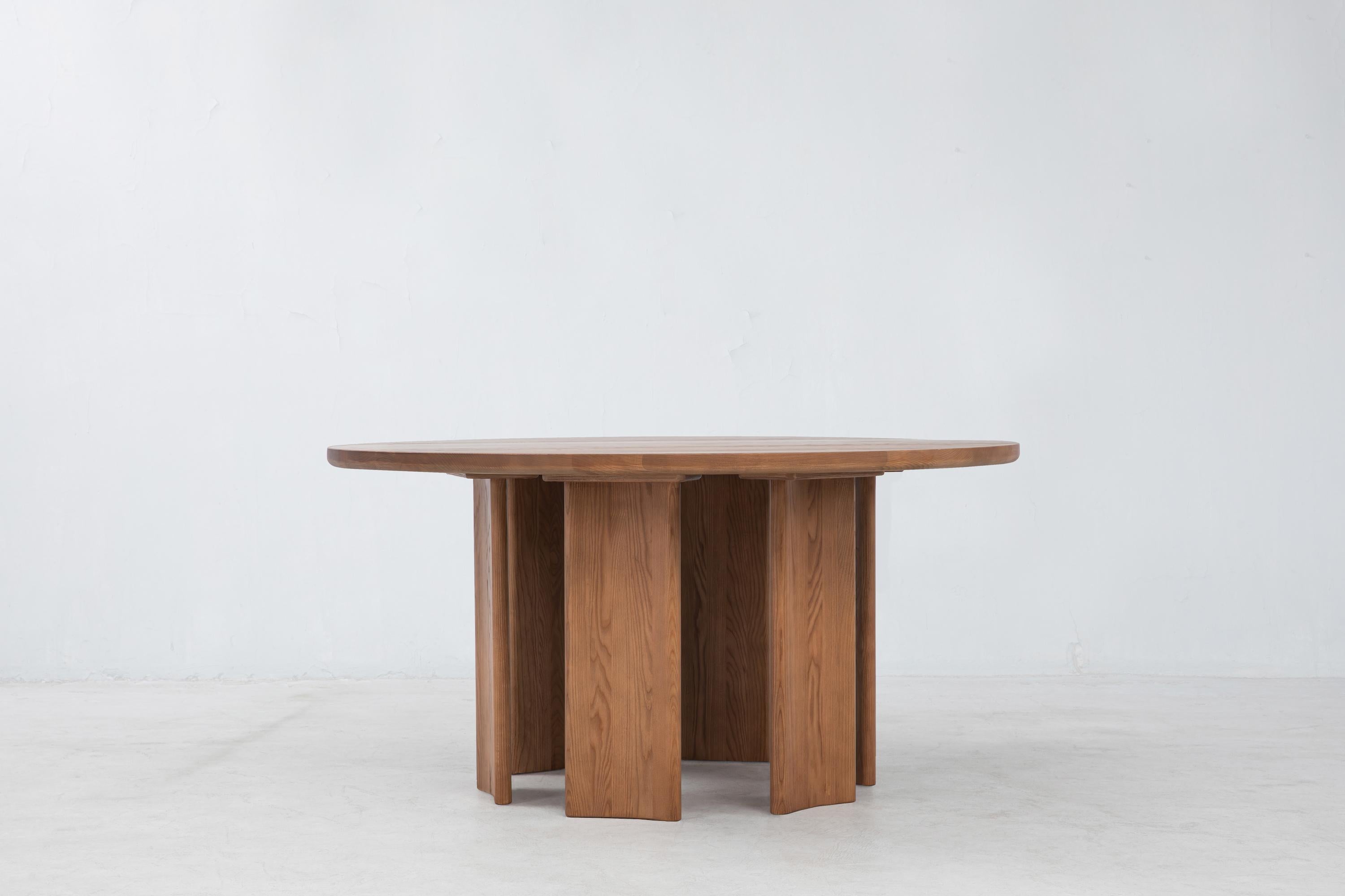 The Crest Round Table is a solid FSC® Certified White Ash dining table. Like the standard Crest Table, the concave columnar legs are invertible. Please note that we make each piece by hand, and every tree is different, so you’ll see slight