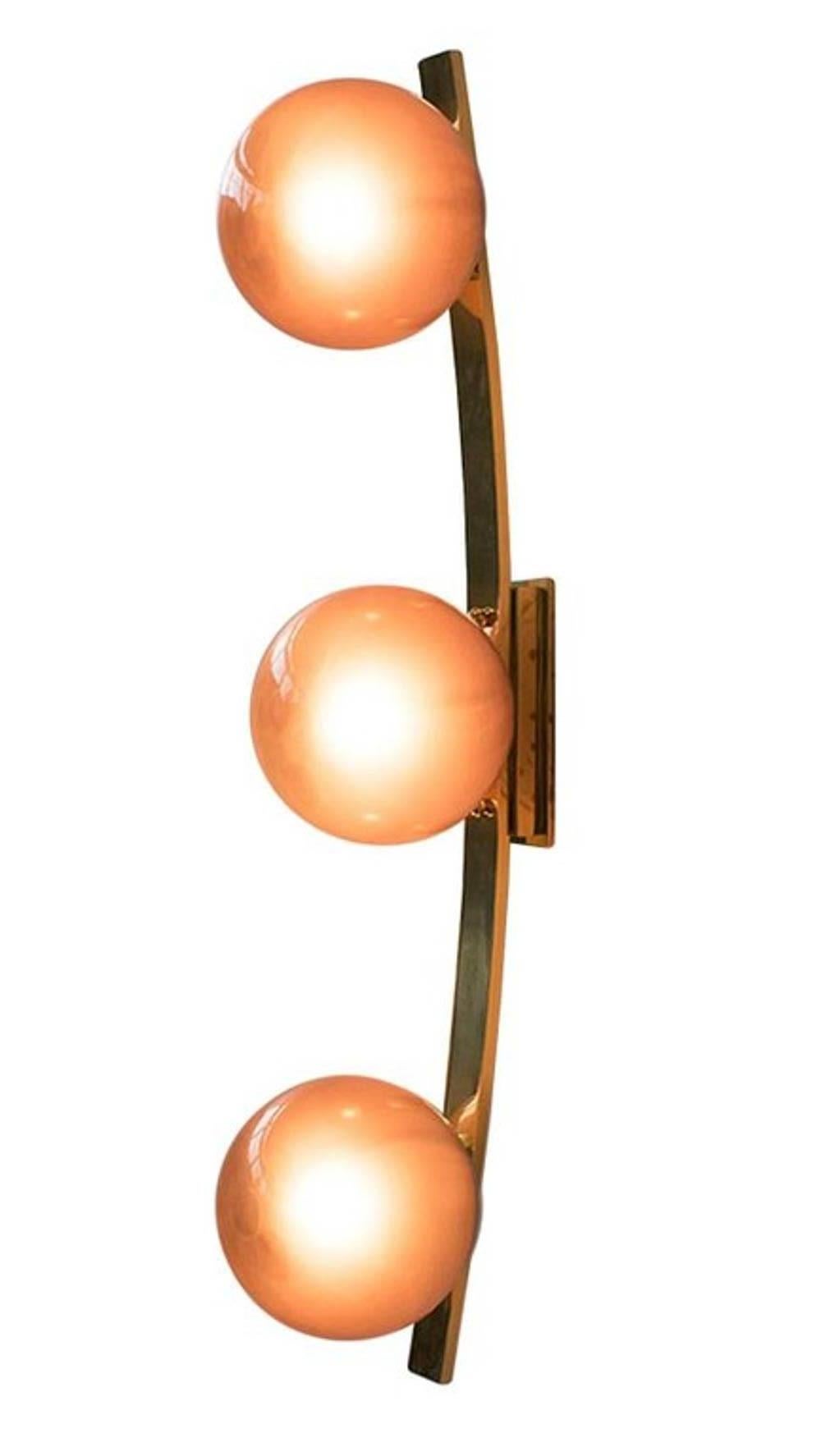 Italian Murano wall light or flush mount with hand blown frosted amethyst Murano glass globes, mounted on curved polished brass finish frame / Designed by Fabio Bergomi / Made in Italy
3 lights / E12 or E14 type / max 40W each
Height: 31.5 inches /