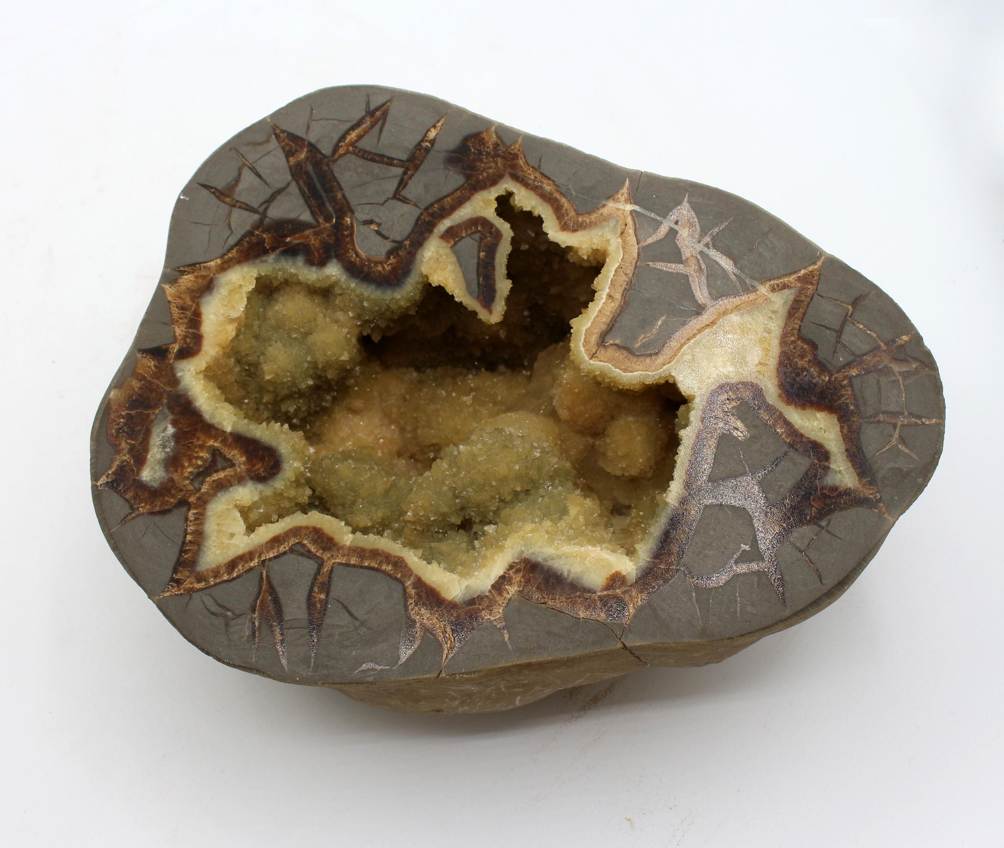 A Cretaceous period calcite septarian nodule, from Utah, resting on custom marble & brass plated stand. Exceptional crystaline interior shapes. Mid century modern stand (resting on, not attached!). Note on base: Sea Bottom Chalk Nodule, Cretaceous