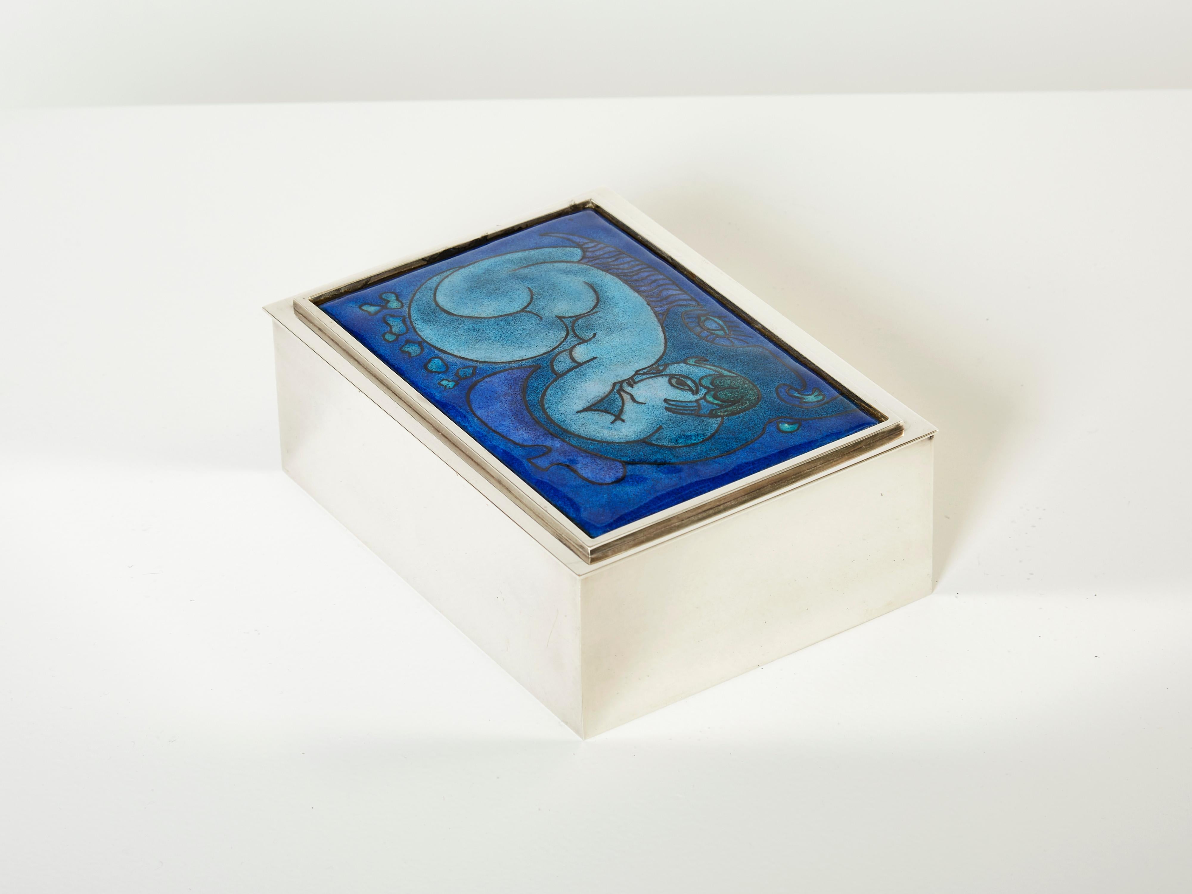 Beautiful French midcentury silvered decorative box produced by Crevillen Paris in the early 1970s. This jewellery box features a beautiful enameled blue ceramic top depicting a woman, with an interior covered with beechwood. The mix of silver,