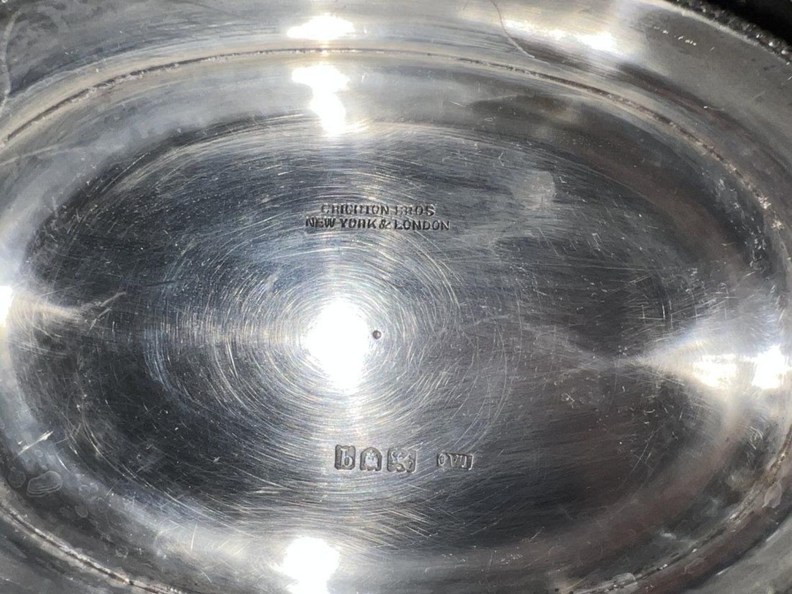 This is a magnificent 1916 English sterling silver basket made by Lionel Alfred Crichton Brothers in London. It weights 29.50 Oz. Fully signed and hallmarked. It has a wonderful detail, design and workmanship. Georgian-style ovular sterling silver