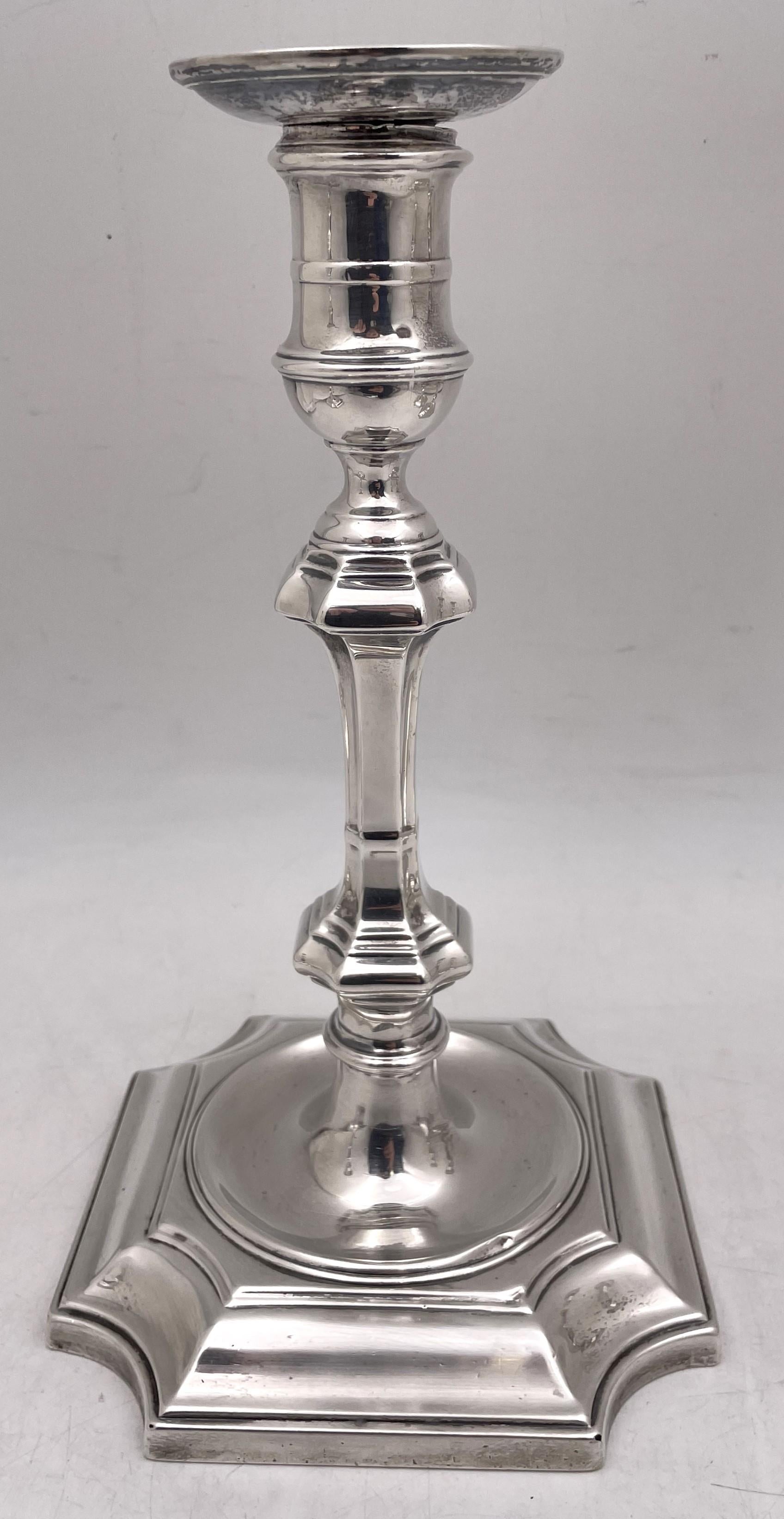 Crichton & Co. set of 4 sterling silver candlesticks in Art Deco style from 1924, with an elegant, geometric design. They measure 10 1/2'' in height by 5 1/2'' in depth at the base, are weighted, and bear hallmarks as shown. 

Crichton & Co. was