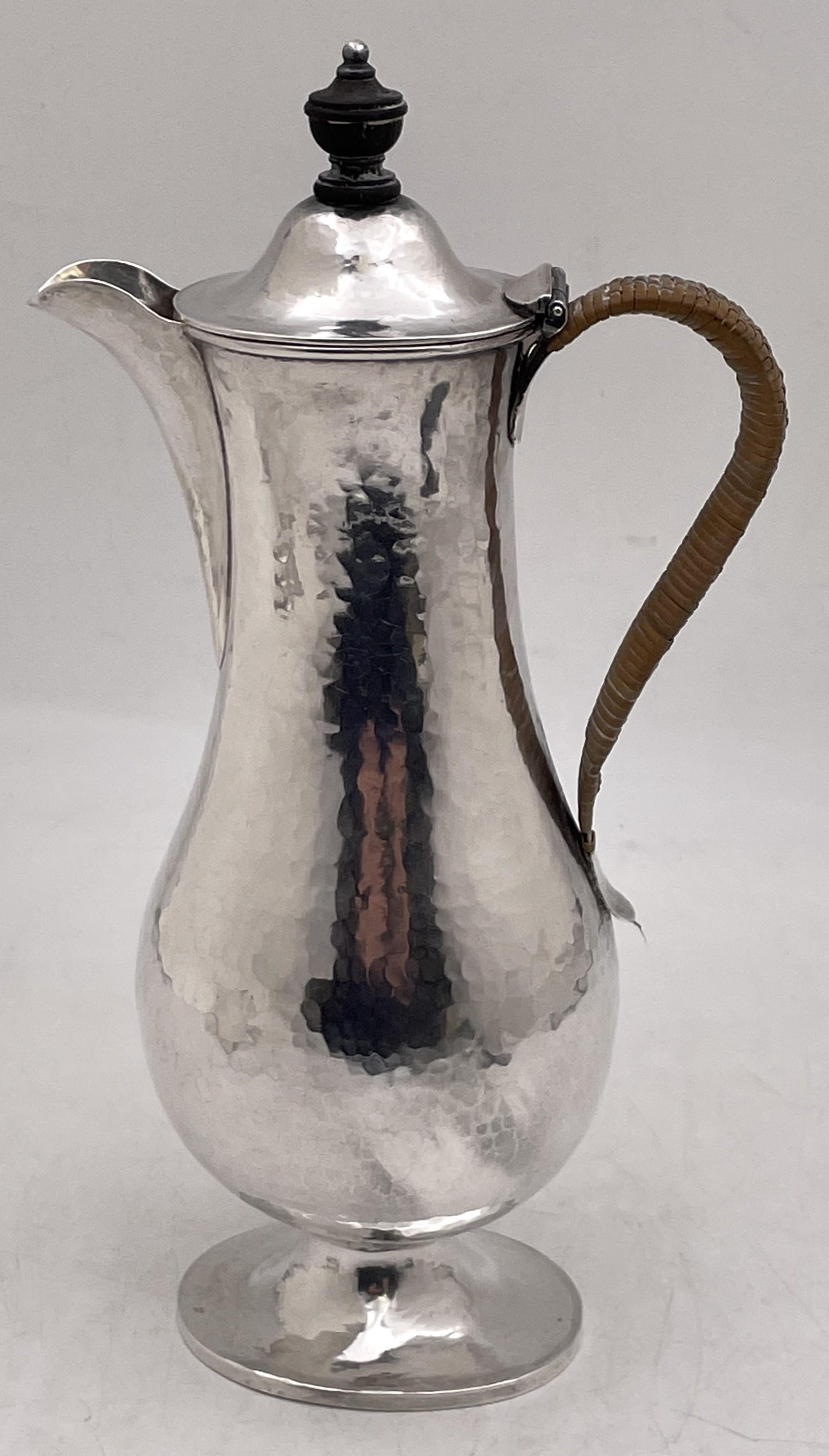 Crichton, English sterling silver coffee pot from 1896, beautifully hand-hammered, and in Arts & Crafts style with an elegant design. It measures 10'' in height by 5 1/8'' from handle to spout, weighs 11 troy ounces, and bears hallmarks as shown.