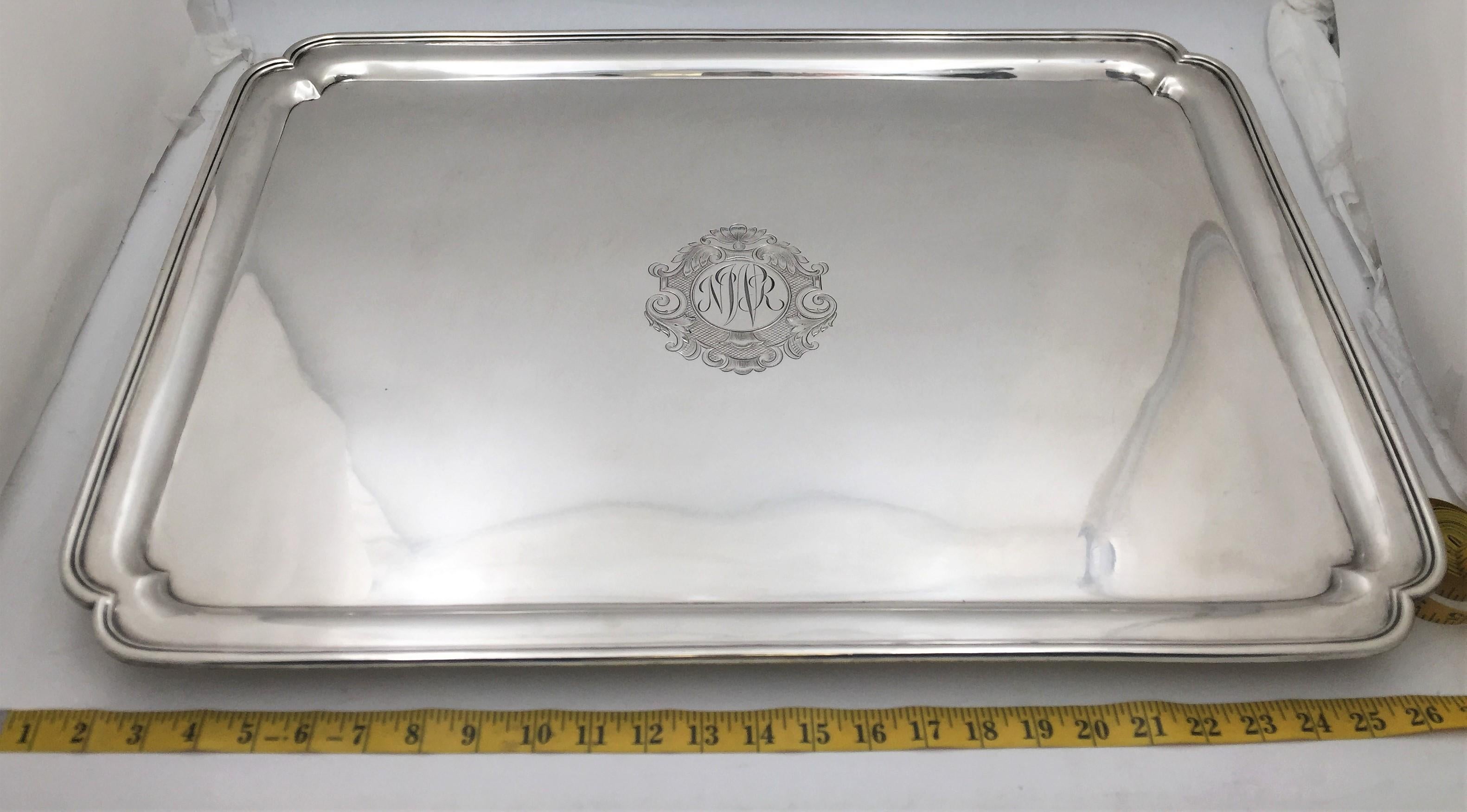 Oversized, one-of-a-kind, massive Crichton & Co. sterling silver tray in Art Deco style from 1927 with a molded rim, standing on four bracket feet, measuring 26'' in length by 18'' in width by 1 1/2'' in height, weighing an impressive 190 troy