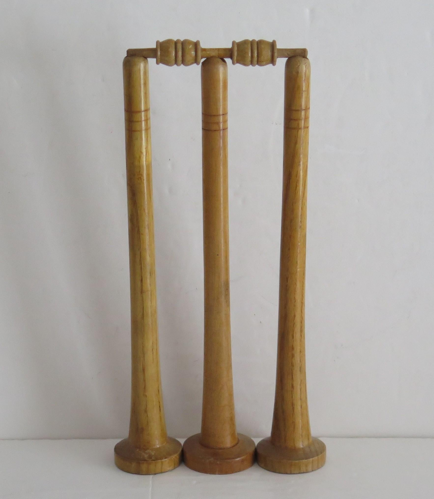 This is an original wooden Cricket Game, all handmade, comprising 18 pieces, for indoor use on a table or carpet, all dating to the late 19th or early 20th century, circa 1900.

This is a classic indoor game of strategy and skill, fun to play for