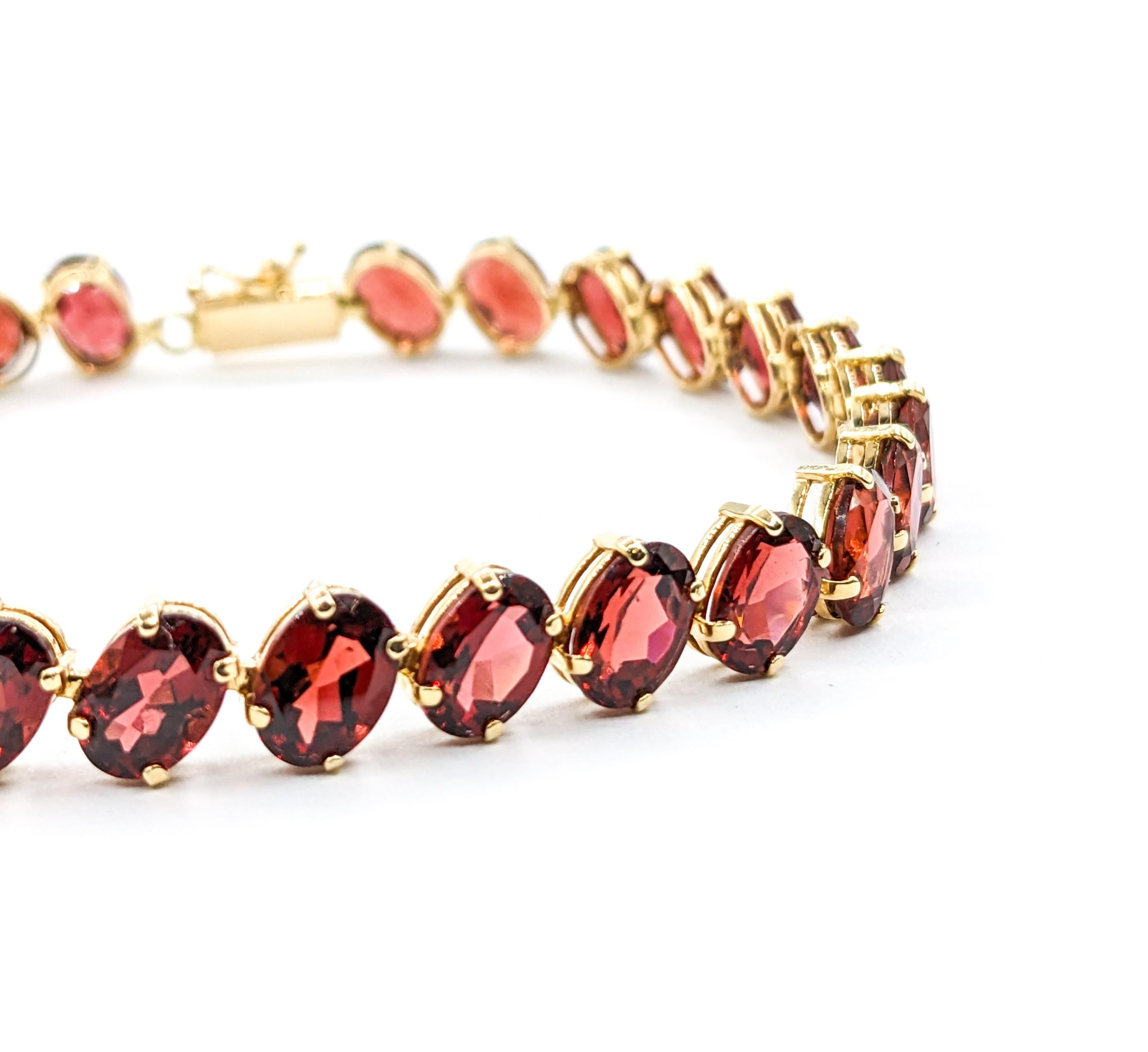 Crimson 26,6ctw Oval Granat-Tennisarmband aus Gelbgold (Ovalschliff)